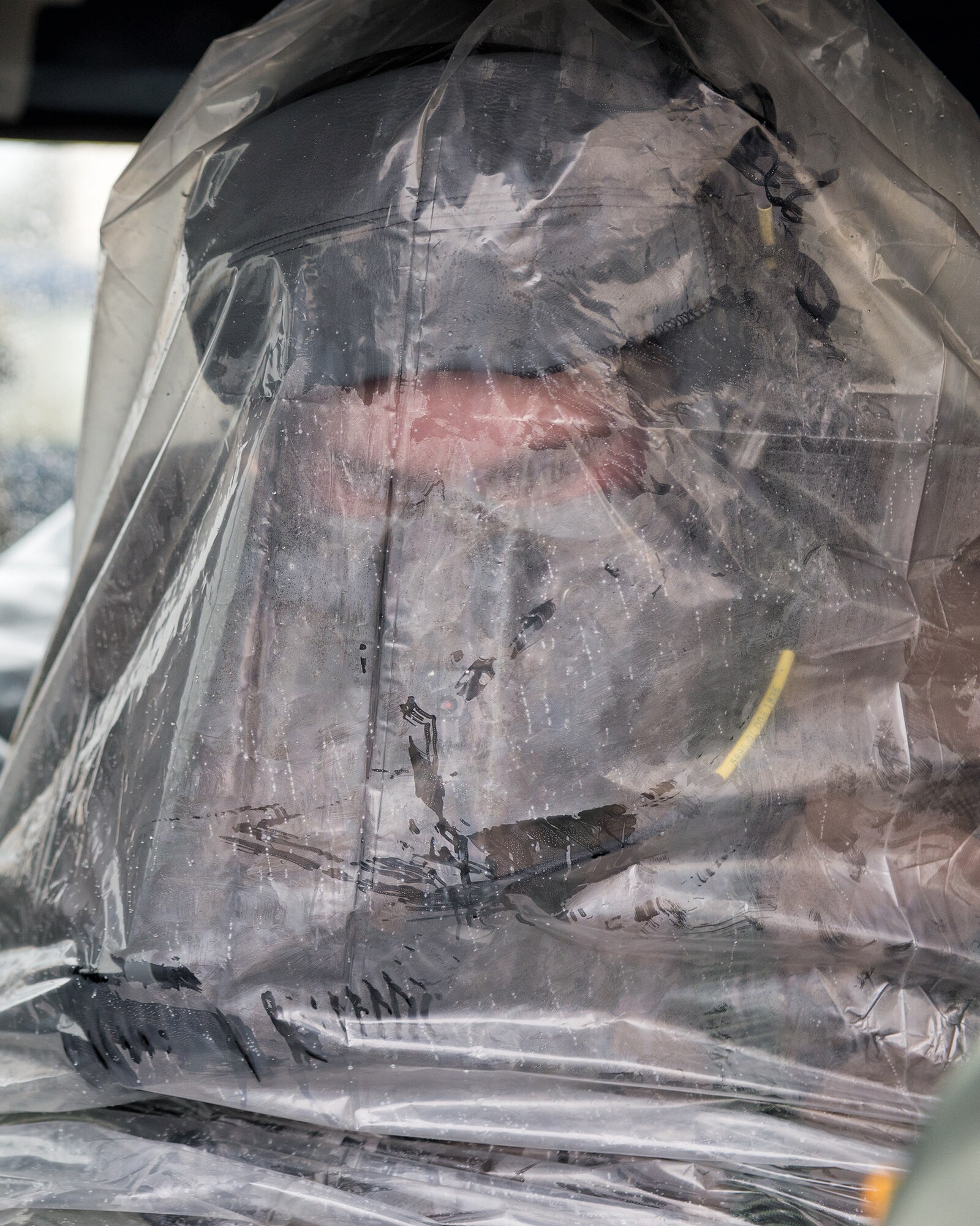 Staff Sgt. Clinton Gossner, a flight engineer from the 36th Airlift Squadron, awaits transportation to his aircraft during the Samurai Readiness Inspection at Yokota Air Base, March 5, 2014.  The Samurai Readiness Inspection tests Yokota’s ability to carry out its mission as the airlift hub in the Pacific during contingency operations. (U.S. Air Force photo by Staff Sergeant Dustin Payne)