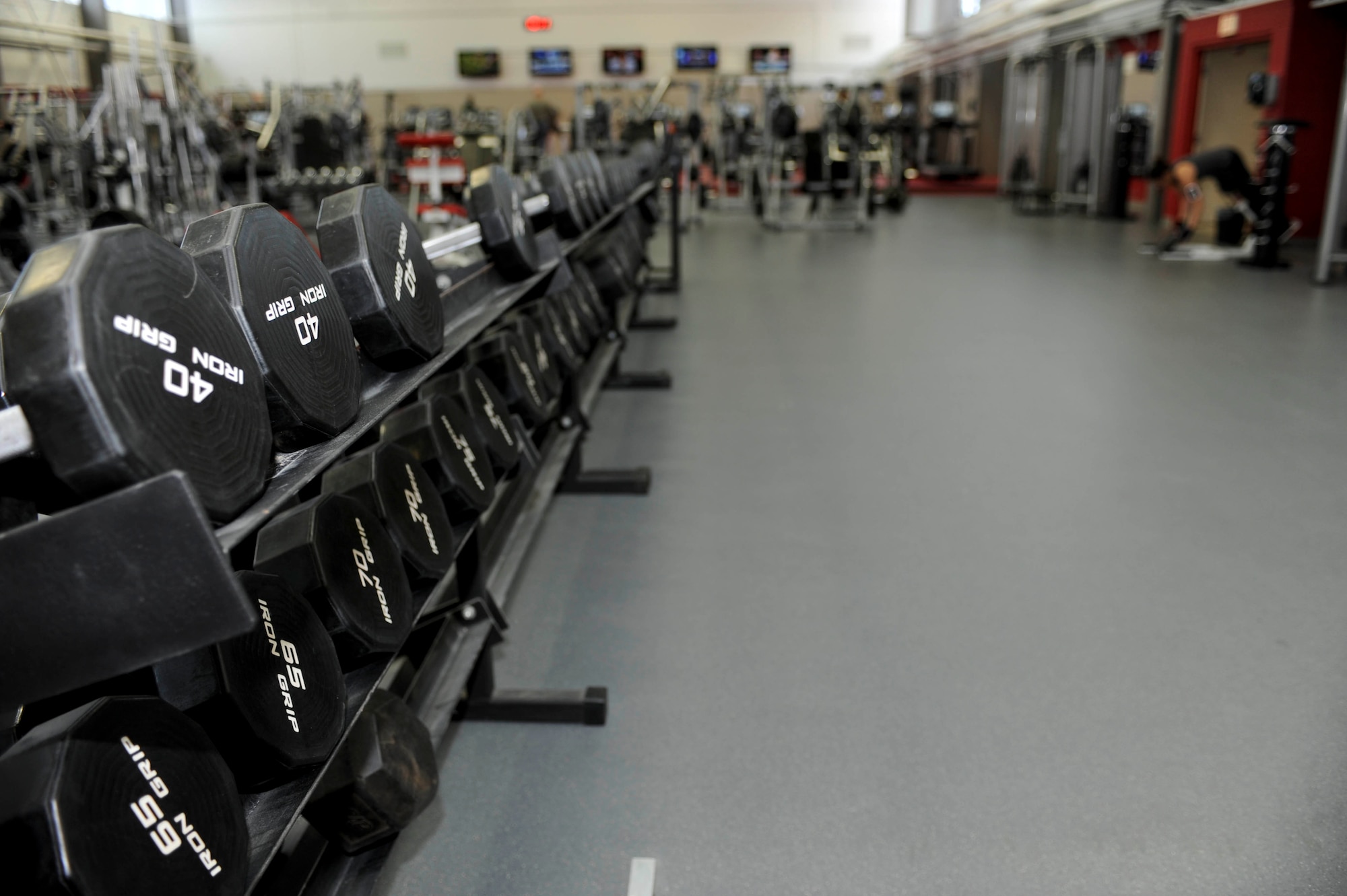 A recent renovation to the main weight room in the Bellamy Fitness Center resulted in more open space for free weights and other exercise equipment at Ellsworth Air Force Base, S.D., Feb. 25, 2014. The weight room was also re-painted and fitted with additional mirrors. (U.S. Air Force photo by Senior Airman Anania Tekurio/Released)