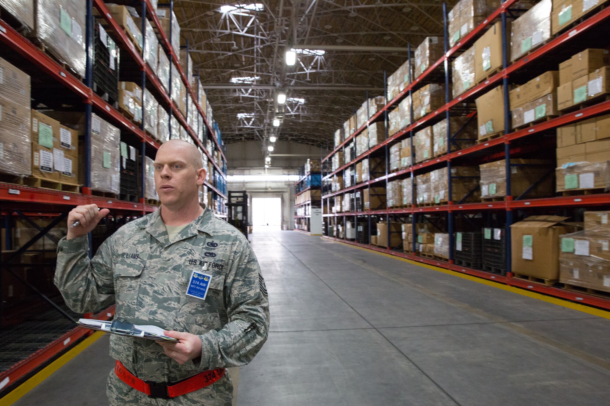 Tech. Sgt. Nathaniel Williams, 374th Logistics Readiness Squadron, inspects the individual protective equipment warehouse during a Samurai Readiness Inspection at Yokota Air Base, Japan, March 5, 2014. During the inspection, maintainers, aircrew and base support functions must synchronize their efforts to complete a series of simulated deployment tasks in order to demonstrate their ability to respond to real-world crises. (U.S. Air Force photo by Osakabe Yasuo/Released)