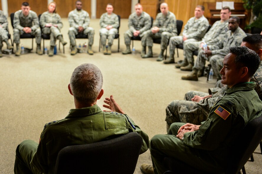 Lt. Gen. Brooks Bash, Air Mobility Command vice commander, left foreground, addresses NCOs March 6, 2014, at Joint Base Lewis-McChord, Wash. Bash was conducting a front-line supervisor roundtable discussion with McChord Airmen during one of his stops on his visit to JBLM. Among the topics discussed during the roundtable were the current force shaping measures, the forthcoming AEF Next deployment system, and tools for mentoring Airmen. (U.S. photo by Tech. Sgt. Sean Tobin)