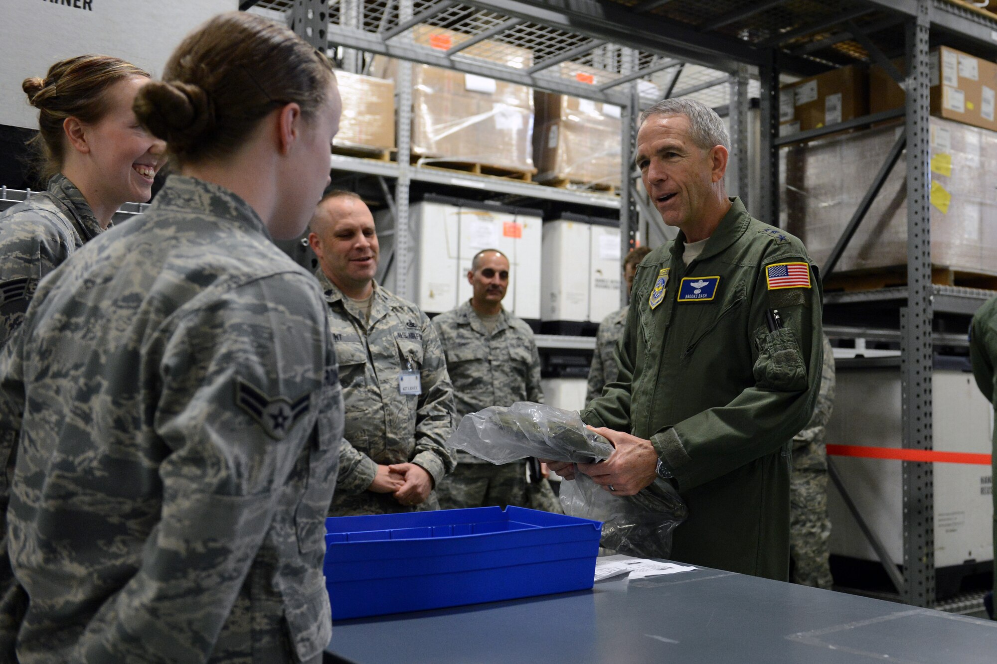 Lt. Gen. Brooks Bash, Air Mobility Command vice commander, talks to Airmen from the 627th Logistics Readiness Squadron, March 5, 2014 at Joint Base Lewis-McChord, Wash. Bash observed Airmen processing through the deployment line during McChord’s position-the-force exercise. (U.S. Air Force photo/Airman 1st Class Jacob Jimenez)