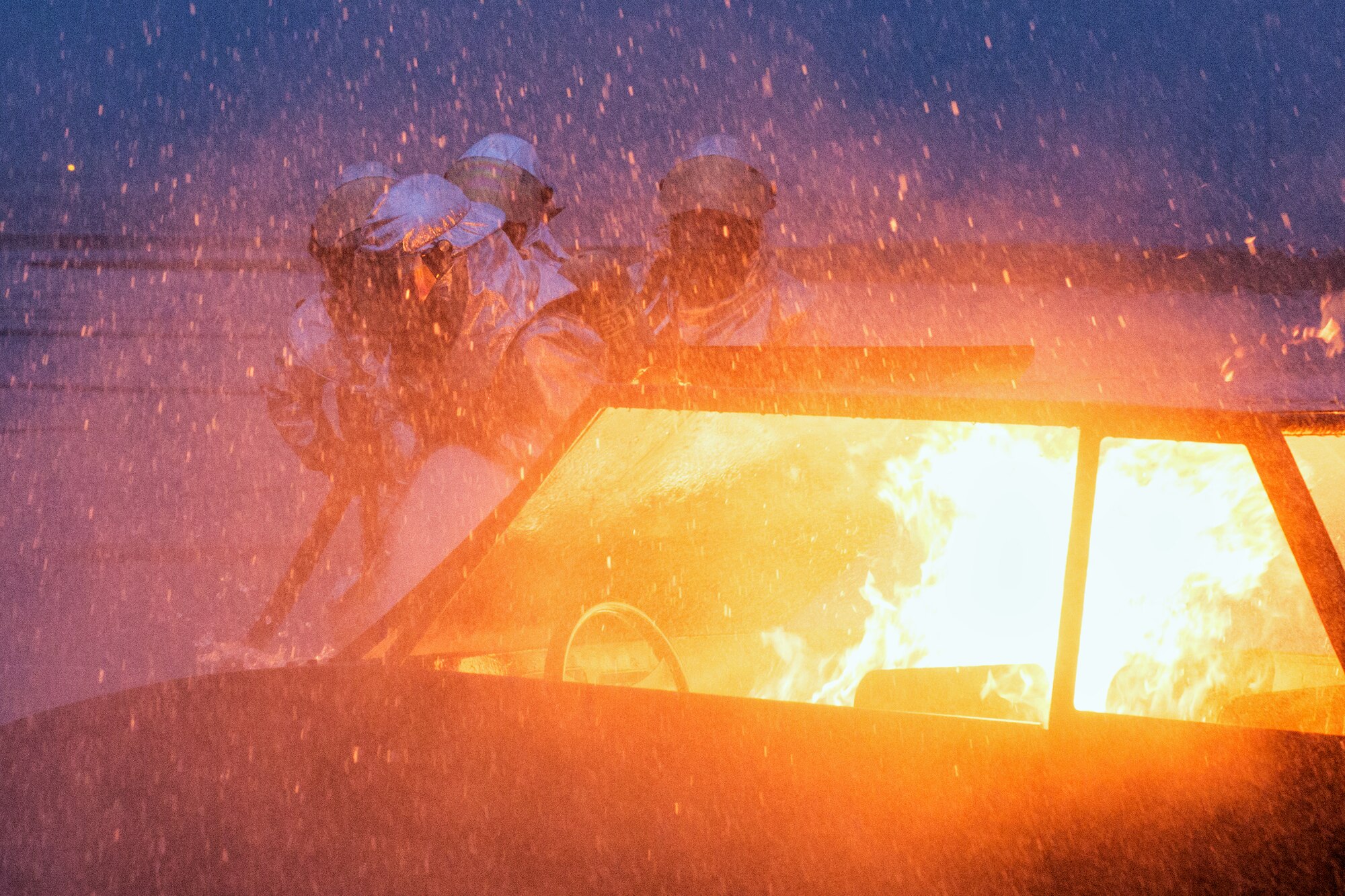 Yokota firefighters battle the blaze on a simulated car explosion during a Samurai Readiness Inspection at Yokota Air Base, Japan, March 5, 2014. The inspection was designed to evaluate Yokota’s ability to provide airlift capabilities while responding to a variety of contingency response scenarios. (U.S. Air Force photo by Osakabe Yasuo/Released)