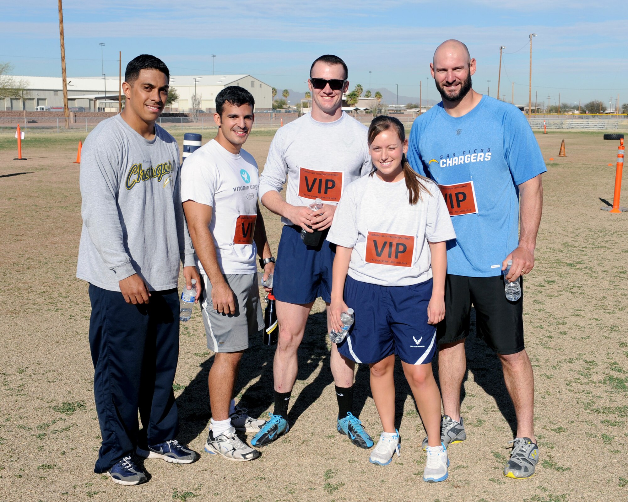Members of "Team VIP", including Jarret Johnson, linebacker for the San Diego Chargers of the National Football League, pose for a picture after completing a Comprehensive Airmen Fitness Day challenge at Davis-Monthan Air Force Base, Ariz., March 3, 2014.  "Team VIP" started the challenge first and finished with the fastest time.  (U.S. Air Force Photo by Airman 1st Class Chris Massey)