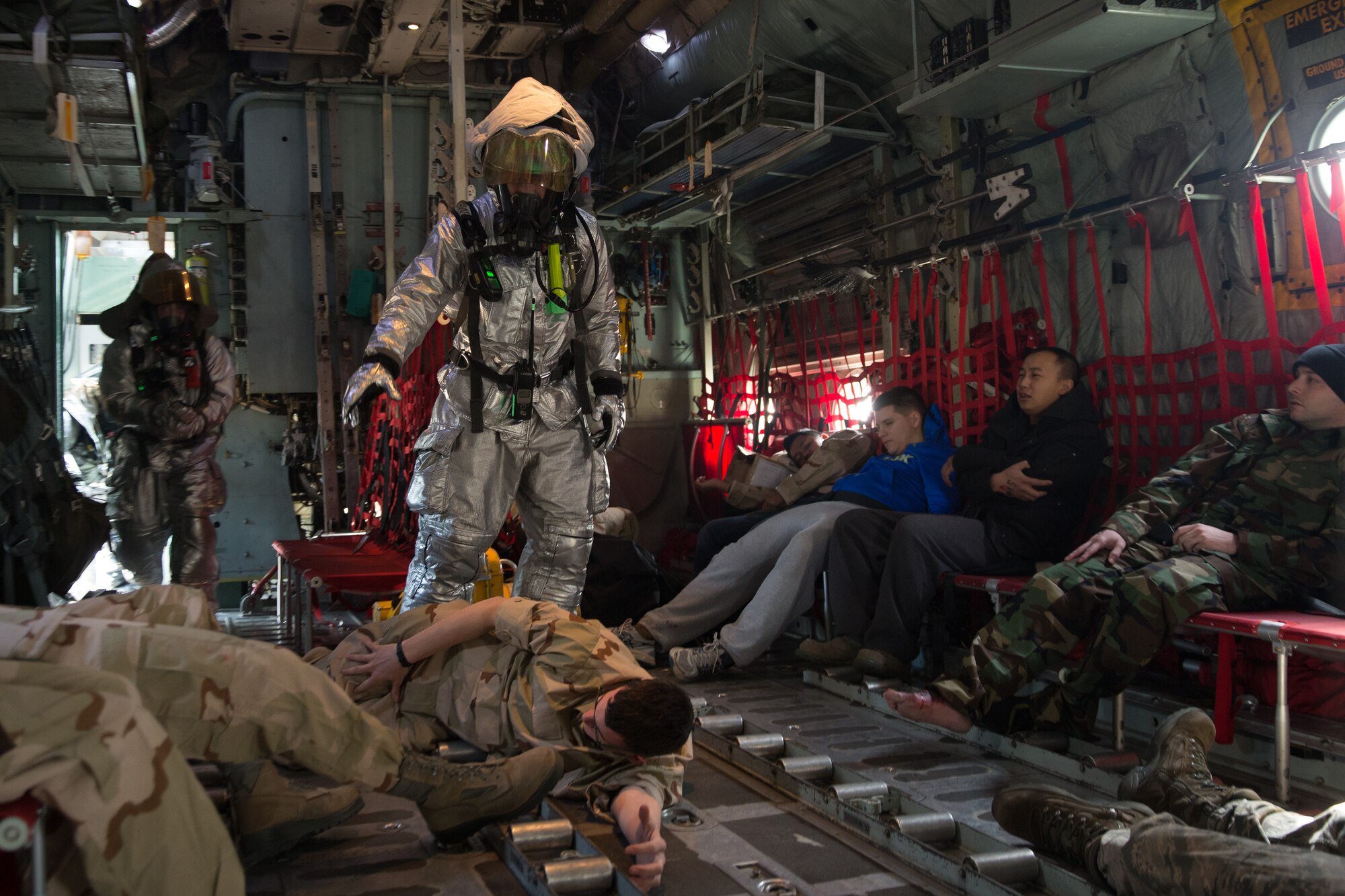 Yokota firefighters arrive on scene and assess the situation during a Samurai Readiness Inspection at Yokota Air Base, Japan, March 4, 2014. The readiness inspection was designed to evaluate areas such as rapid mobility response to simulated contingencies and providing airlift support to military and non-combatant evacuation. (U.S. Air Force photo by Osakabe Yasuo/Released)