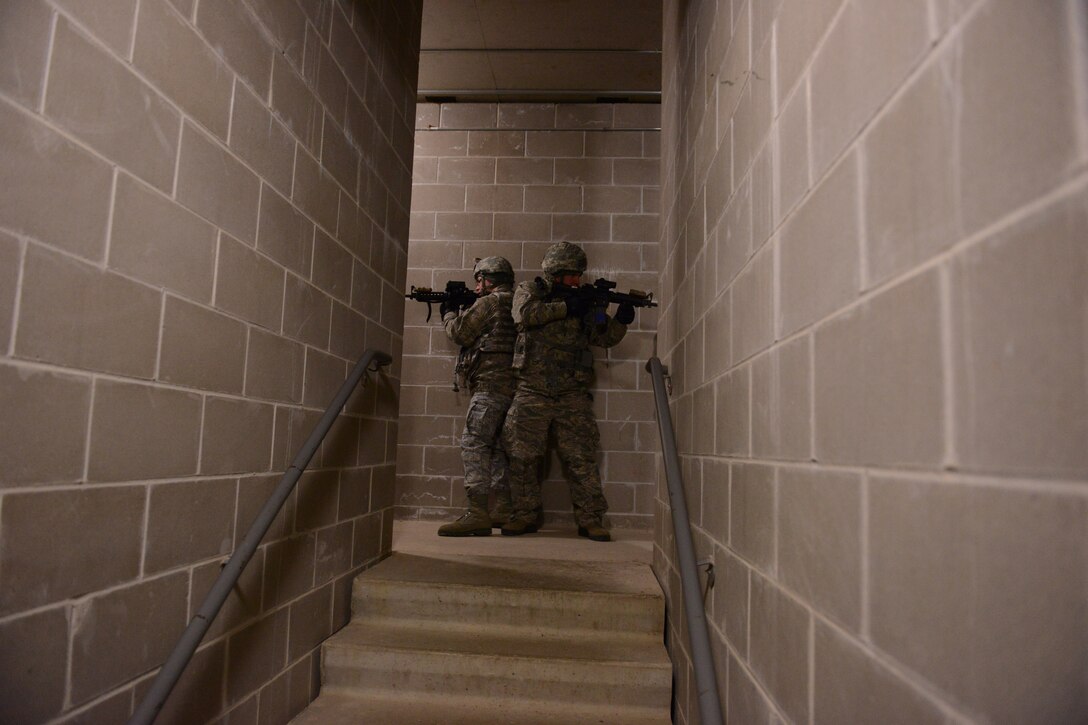 U.S. Air Force Senior Airmen Tyler Ranta and Joshua Nelson, 148th Fighter Wing, Duluth, Minn. practice building clearing procedures while in training Feb. 28th, 2014.  148FW Security Forces personnel were at Camp Ripley, Minn. from 27 Feb - 2 March, 2014 to train in combat readiness tasks.  (U.S. Army National Guard photo by Staff Sgt. Anthony A. Housey/Released)