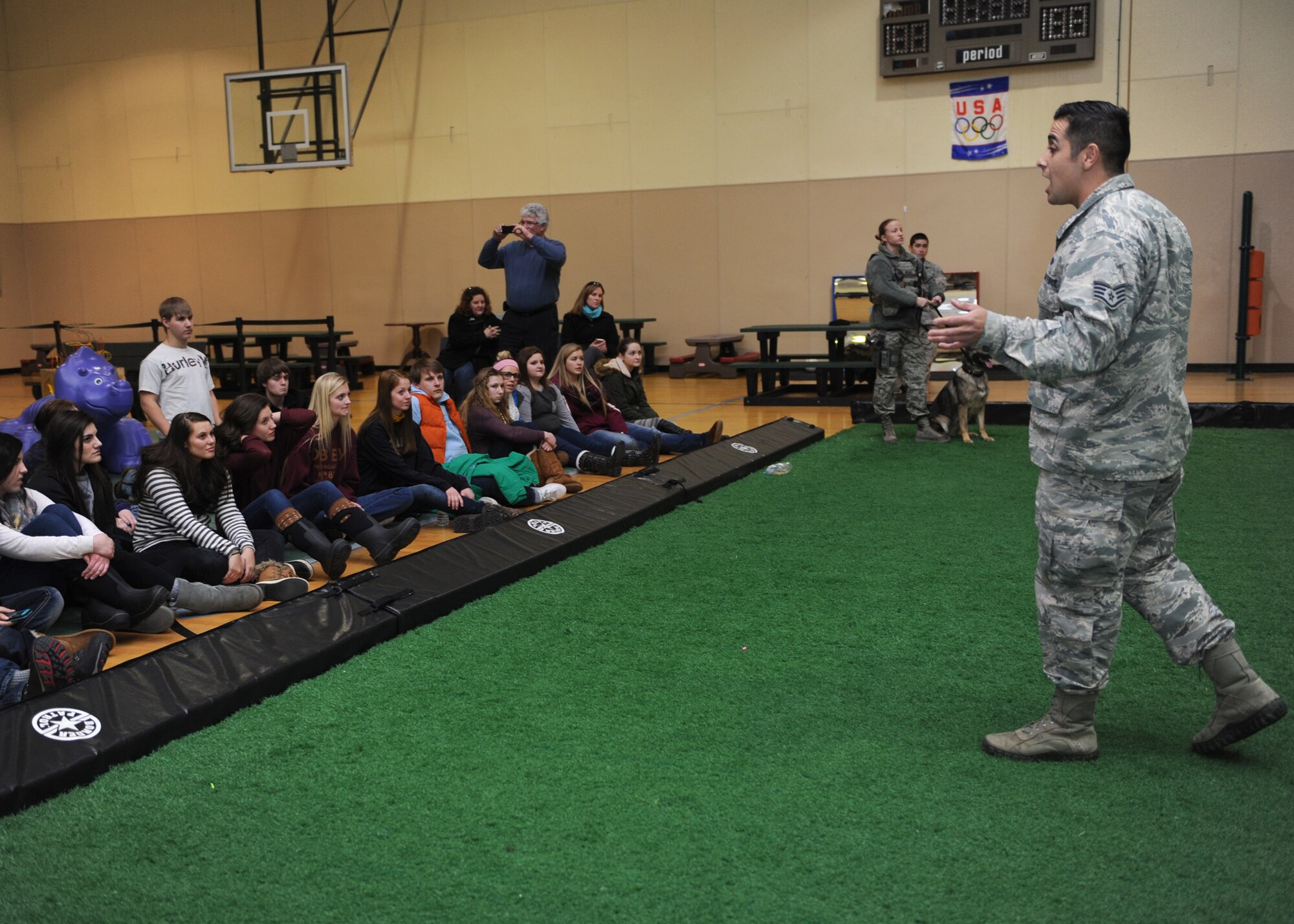 Staff Sgt. Antonio Padilla, 341st Security Forces Squadron K-9 handler, speaks to more than 50 Cascade County high school students during a Leadership High School tour at the Malmstrom Fitness Center on Feb. 26. The hands-on tour gave students the opportunity to receive a wing mission brief from Col. Marné Deranger, 341st Missile Wing vice commander, visit the 341st SFS military working dog section and the 341st Security Forces Group armory. (U.S. Air Force photo/Senior Airman Katrina Heikkinen)