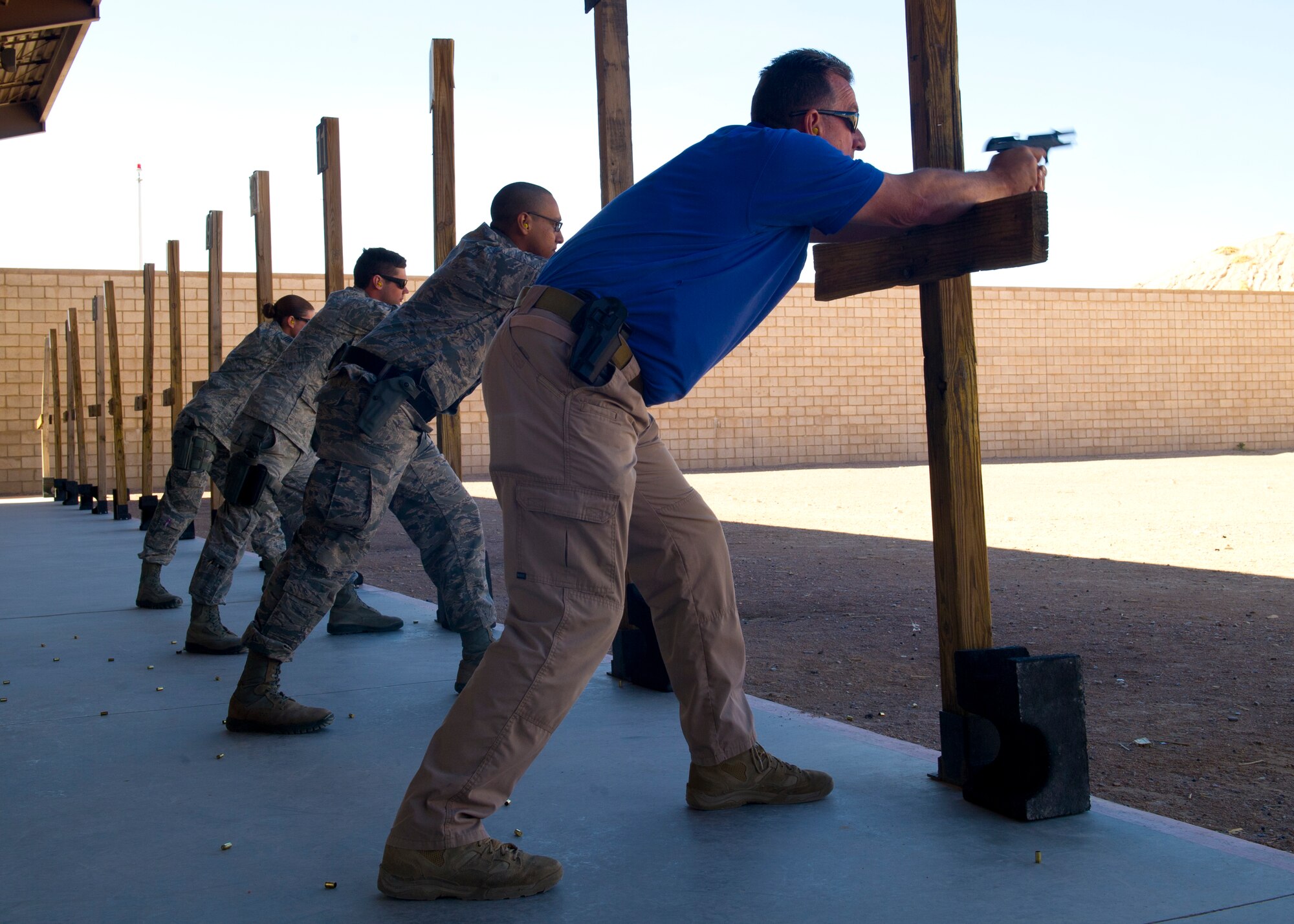 Members from the 49th Security Forces Squadron begin their weapons qualification course at Holloman Air Force Base, N.M., March 5. Four Security Forces members took the M-9 pistol Air Force Qualification Course at Holloman’s Combat Arms Training and Maintenance site. This course is designed to help Airmen become mission effective as well as combat ready. (U.S. Air Force photo by Airman 1st Class Leah Ferrante/Released)  
