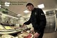 Airman 1st Class Justin Baniwas is making a conscientious choice to eat healthy by “going for green” at the Joint Base Andrews, Md., Dining Facility on Feb. 28, 2014. Baniwas is with the 779th Medical Staging Squadron and works as an outpatient records technician. (U.S. Air Force photo/ Ms. Amber J. Russell) 