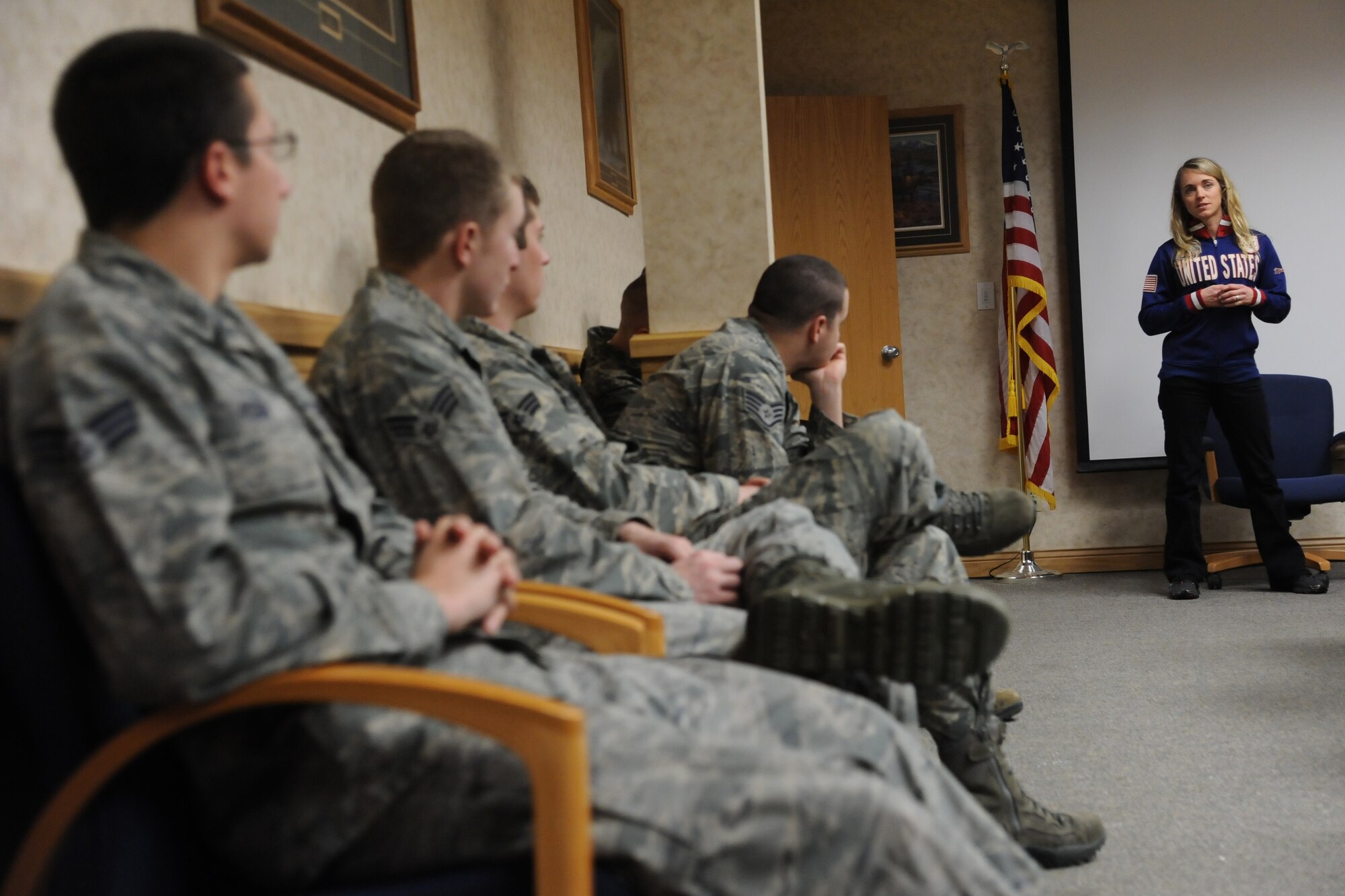 Erin Simmons-Nemec, former U.S. Olympic snowboarder, speaks to members of the 819th Rapid Engineer Deployable Heavy Operational Repair Squadron of Engineers about her experience as an Olympic athlete and her life following the games during a visit to the RED HORSE command building Feb. 28. Simmons-Nemec and Ann Battelle, former U.S. Olympic mogul skier, shared their stories of struggle and accomplishment during their journeys to the Olympics in order to promote a resilient attitude throughout Air Force Global Strike Command. (U.S. Air Force photo/Senior Airman Cortney Paxton)