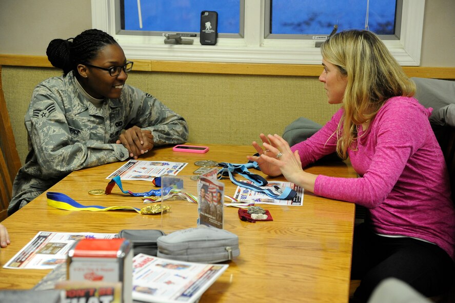 Erin Simmons-Nemec, former U.S. Olympic snowboarder (right), shares stories about her Olympic and X-Games career with Senior Airman Khadija Price, 341st Missile Security Forces Squadron member, during her visit to a missile alert facility Feb. 27. Simmons-Nemec visited the MAF along with fellow Olympian Anne Battelle and American300 founder Robi Powers to encourage Airmen in the field and share what they believed helped them overcome obstacles. (U.S. Air Force photo/Airman 1st Class Collin Schmidt)
