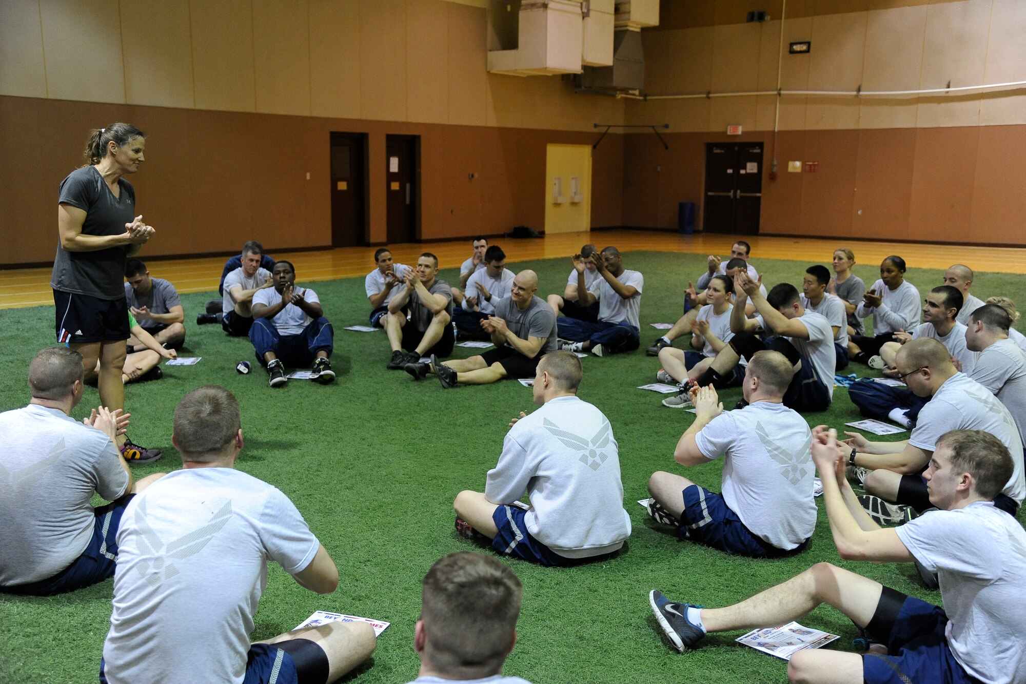 Anne Battelle, former U.S. Olympic mogul skier, speaks with students of Airman Leadership School after a physical training session at the base gym Feb. 26. Battelle toured Malmstrom Air Force base during the American300 Never Quit Series tour to speak with Airmen about accomplishing her goals and the benefit of perseverance in the face of adversity. (U.S. Air Force photo/Airman 1st Class Collin Schmidt)