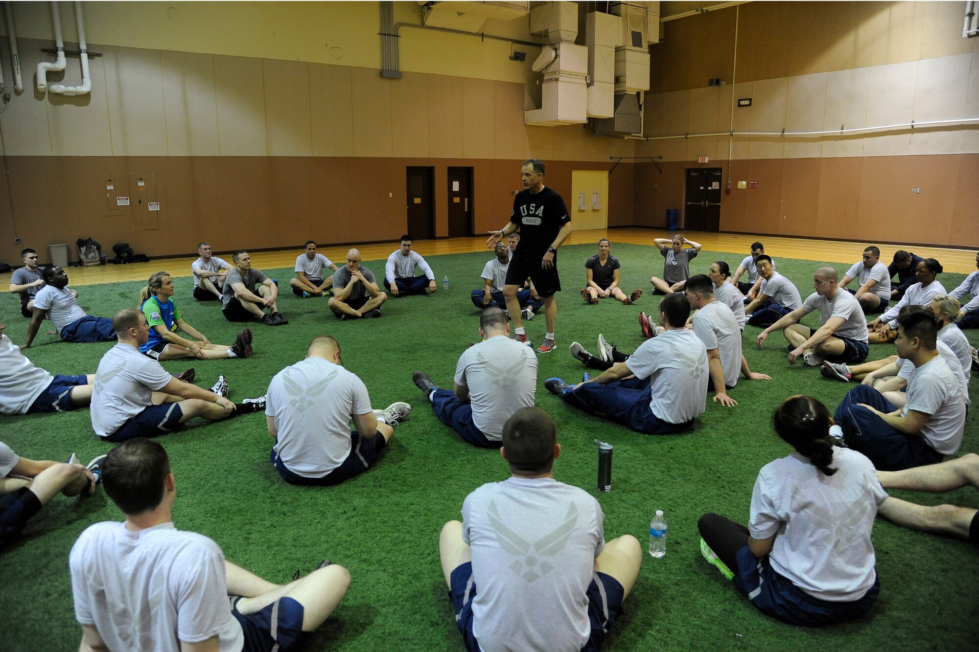 Robi Powers, American300 tours Never Quit Series founder, speaks with students of Airman Leadership School after a physical training session at the base gym on Feb. 26. During the tour, Powers was accompanied by two former Olympic winter sports athletes who shared their success stories with Airmen around Malmstrom Air Force Base. (U.S. Air Force photo/Airman 1st Class Collin Schmidt)