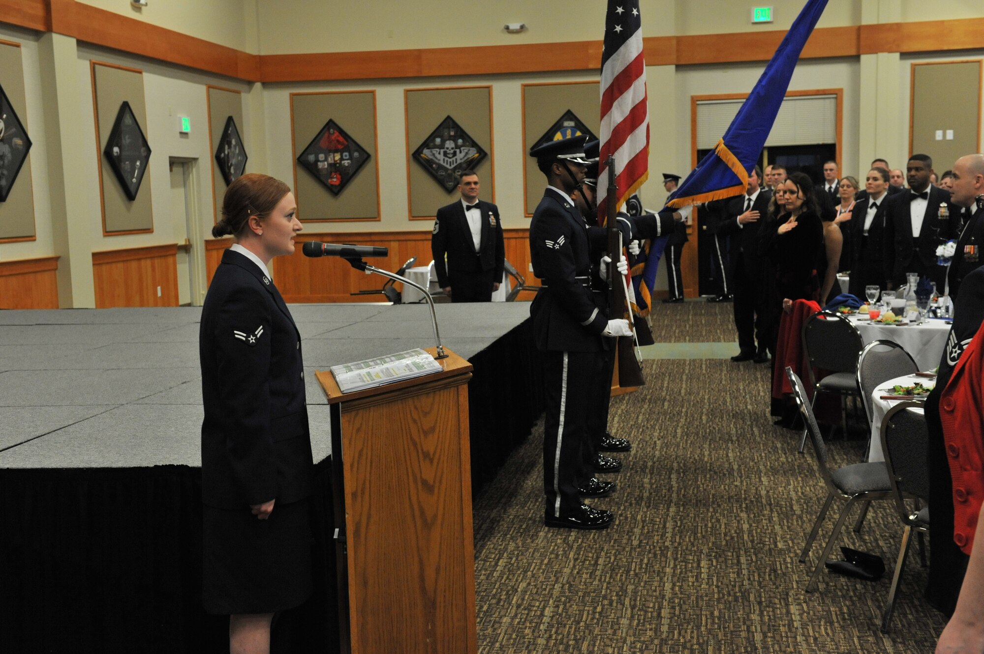 Airman 1st Class Courtney Gardner, 341st Force Support Squadron remote nuclear facility chef, sings the national anthem at the 2013 Annual Awards Banquet Feb. 28.  Following the anthem, members of Malmstrom’s Honor Guard placed hats on an empty table in recognition of prisoners of war and persons missing in action as part of the opening ceremonies. (U.S. Air Force photo/ John Turner)