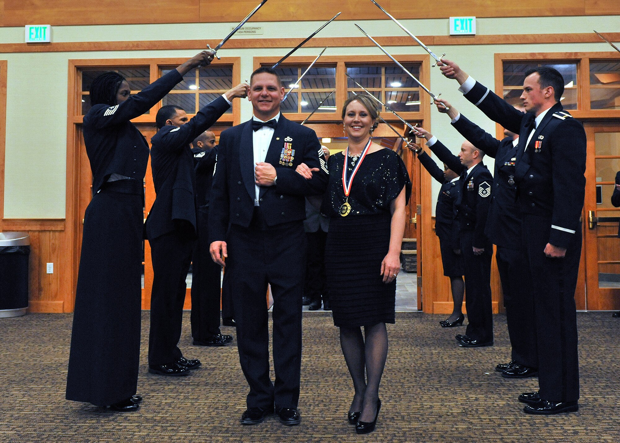 Airman 1st Class Casey Bennett, 341st Force Support Squadron remote nuclear facility chef (right), receives her Airman of the Year nomination medal from Col. Robert Stanley, 341st Missile Wing commander, during the 2013 Annual Awards Banquet Medallion Ceremony on Feb. 28. Seven Airmen were nominated for the Airman of the Year award for their service, dedication and work ethic. (U.S. Air Force photo/Airman 1st Class Collin Schmidt)