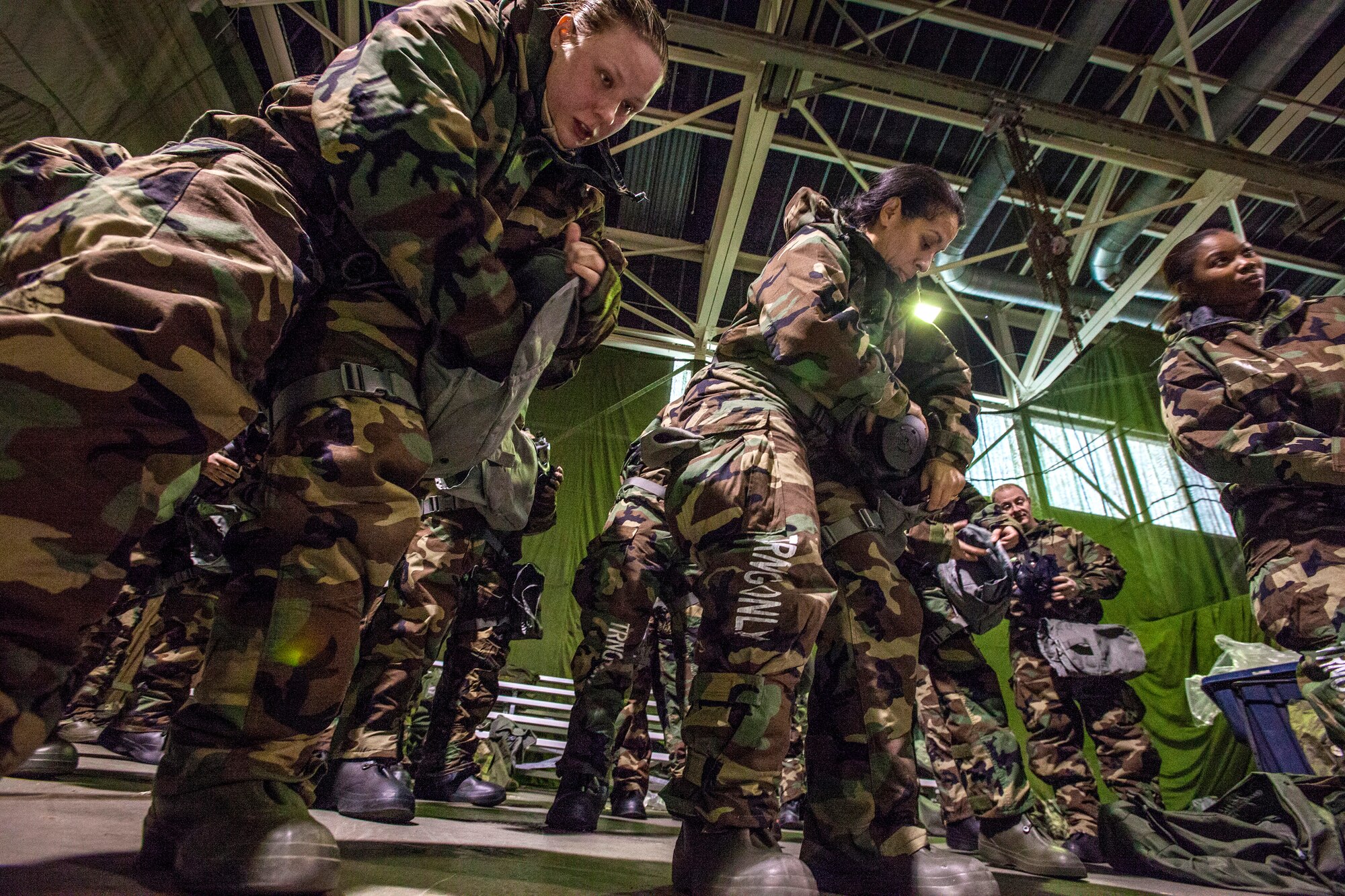Airmen from the 108th Wing, New Jersey Air National Guard, put away their M50 Joint Service General Purpose Masks as they brush up on their chemical, biological, radiological and nuclear; self-aid buddy care; post attack reconnaissance and disassembling and reassembling Beretta M9 pistol and M16 rifle skills during the Wing’s Ability to Survive and Operate Rodeo at Joint Base McGuire-Dix-Lakehurst, N.J. Feb. 9, 2014. The Wing-level evaluation shows what training areas need more focus. ATSO is used by Airmen who are deploying or preparing for exercises or inspections. These skills make up the foundation necessary for all Airmen to function effectively in hostile environments. (U.S. Air National Guard photo by Master Sgt. Mark C. Olsen/Released)
