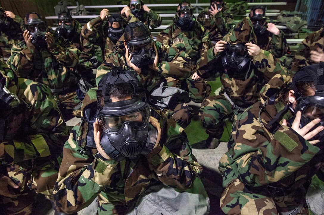 Airmen from the 108th Wing, New Jersey Air National Guard, don their M50 Joint Service General Purpose Masks as they brush up on their chemical, biological, radiological and nuclear; self-aid buddy care; post attack reconnaissance and disassembling and reassembling Beretta M9 pistol and M16 rifle skills during the Wing’s Ability to Survive and Operate Rodeo at Joint Base McGuire-Dix-Lakehurst, N.J. Feb. 9, 2014. The Wing-level evaluation shows what training areas need more focus. ATSO is used by Airmen who are deploying or preparing for exercises or inspections. These skills make up the foundation necessary for all Airmen to function effectively in hostile environments. (U.S. Air National Guard photo by Master Sgt. Mark C. Olsen/Released)