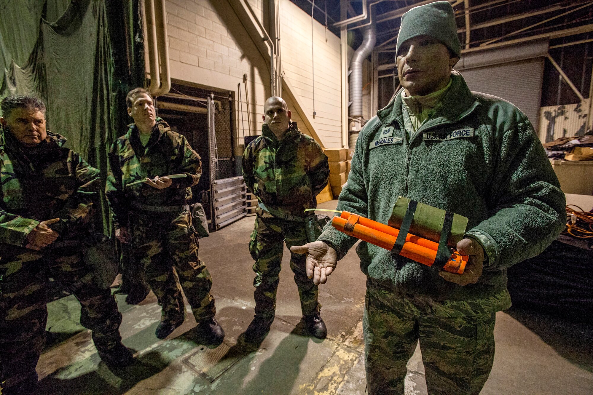 Tech. Sgt. Carlos L. Morales trains Airmen on the post attack reconnaissance process as Airmen from the 108th Wing, New Jersey Air National Guard, brush up on their chemical, biological, radiological and nuclear; self-aid buddy care; post attack reconnaissance and disassembling and reassembling Beretta M9 pistol and M16 rifle skills during the Wing’s Ability to Survive and Operate Rodeo at Joint Base McGuire-Dix-Lakehurst, N.J. Feb. 9, 2014. The Wing-level evaluation shows what training areas need more focus. ATSO is used by Airmen who are deploying or preparing for exercises or inspections. These skills make up the foundation necessary for all Airmen to function effectively in hostile environments. (U.S. Air National Guard photo by Master Sgt. Mark C. Olsen/Released)