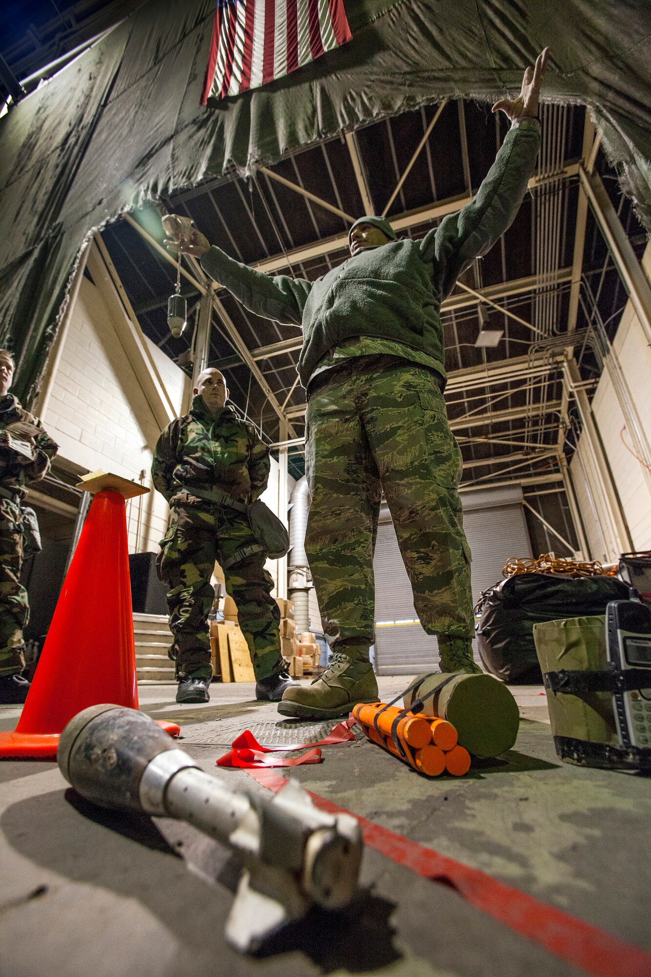 Tech. Sgt. Carlos L. Morales trains Airmen on the post attack reconnaissance process as Airmen from the 108th Wing, New Jersey Air National Guard, brush up on their chemical, biological, radiological and nuclear; self-aid buddy care; post attack reconnaissance and disassembling and reassembling Beretta M9 pistol and M16 rifle skills during the Wing’s Ability to Survive and Operate Rodeo at Joint Base McGuire-Dix-Lakehurst, N.J. Feb. 9, 2014. The Wing-level evaluation shows what training areas need more focus. ATSO is used by Airmen who are deploying or preparing for exercises or inspections. These skills make up the foundation necessary for all Airmen to function effectively in hostile environments. (U.S. Air National Guard photo by Master Sgt. Mark C. Olsen/Released)