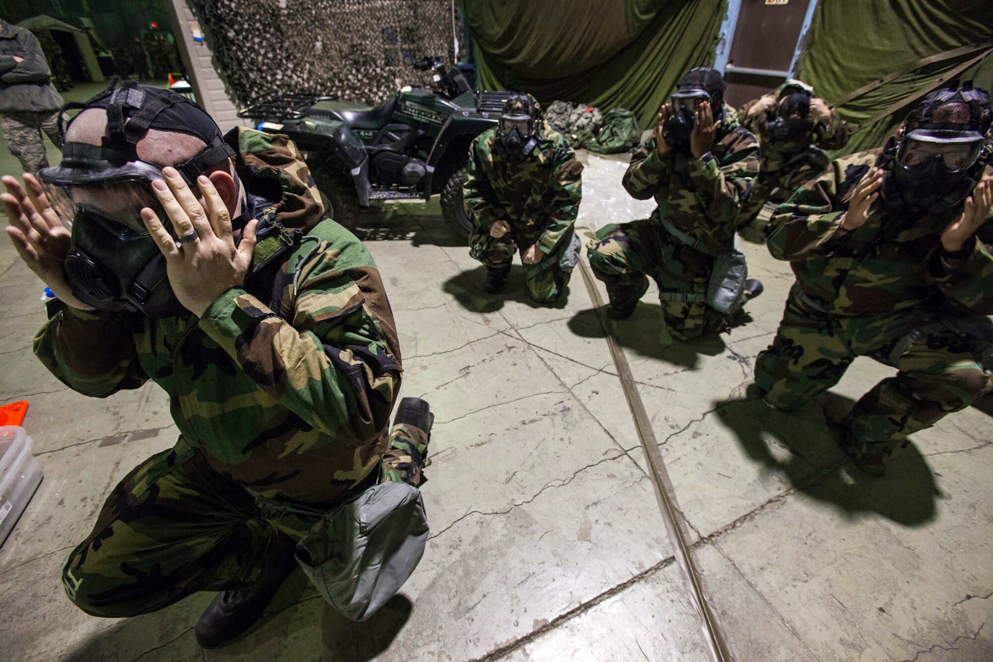 Airmen from the 108th Wing, New Jersey Air National Guard, don their M50 Joint Service General Purpose Masks as they brush up on their chemical, biological, radiological and nuclear; self-aid buddy care; post attack reconnaissance and disassembling and reassembling Beretta M9 pistol and M16 rifle skills during the Wing’s Ability to Survive and Operate Rodeo at Joint Base McGuire-Dix-Lakehurst, N.J. Feb. 9, 2014. The Wing-level evaluation shows what training areas need more focus. ATSO is used by Airmen who are deploying or preparing for exercises or inspections. These skills make up the foundation necessary for all Airmen to function effectively in hostile environments. (U.S. Air National Guard photo by Master Sgt. Mark C. Olsen/Released)