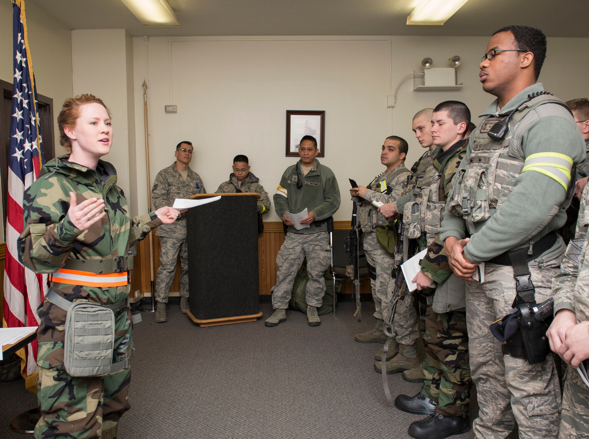 Capt. Ann Marie Sutter, 374th Airlift Wing Legal Office chief of the adverse actions, briefs the members of 374th Security Forces Squadron during the Samurai Readiness Inspection at Yokota Air Base, Japan, March 6, 2014.  The briefing consisted of the Geneva Convention s, following the rules of engagement, and procedures on capturing prisoners of war, to raise the awareness of how the U.S. humanely treats the adversary.  (U.S. Air Force photo by Staff Sgt. Andrea Salazar / released)