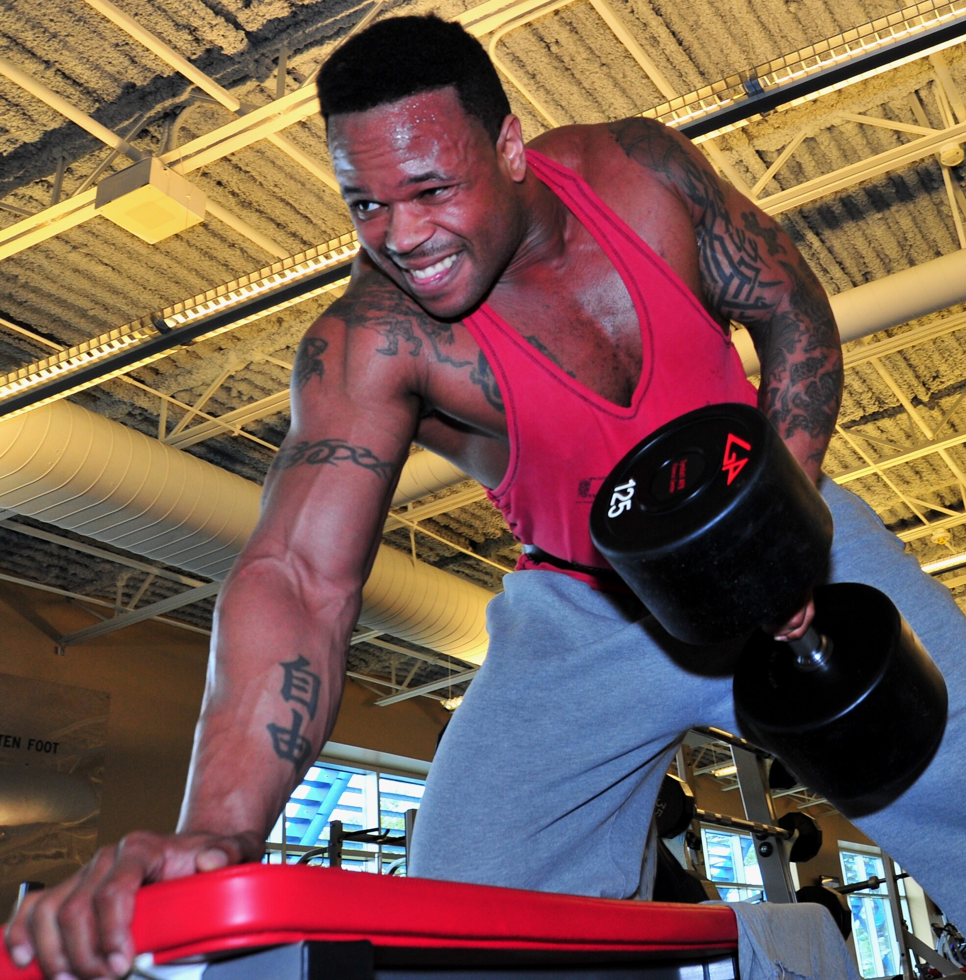 Master Sgt. Randy Aikens, 325th Maintenance Squadron test cell section chief, weight trains March 5 at the base fitness center. (U.S. Air Force photo by Staff Sgt. Rachelle Blake)