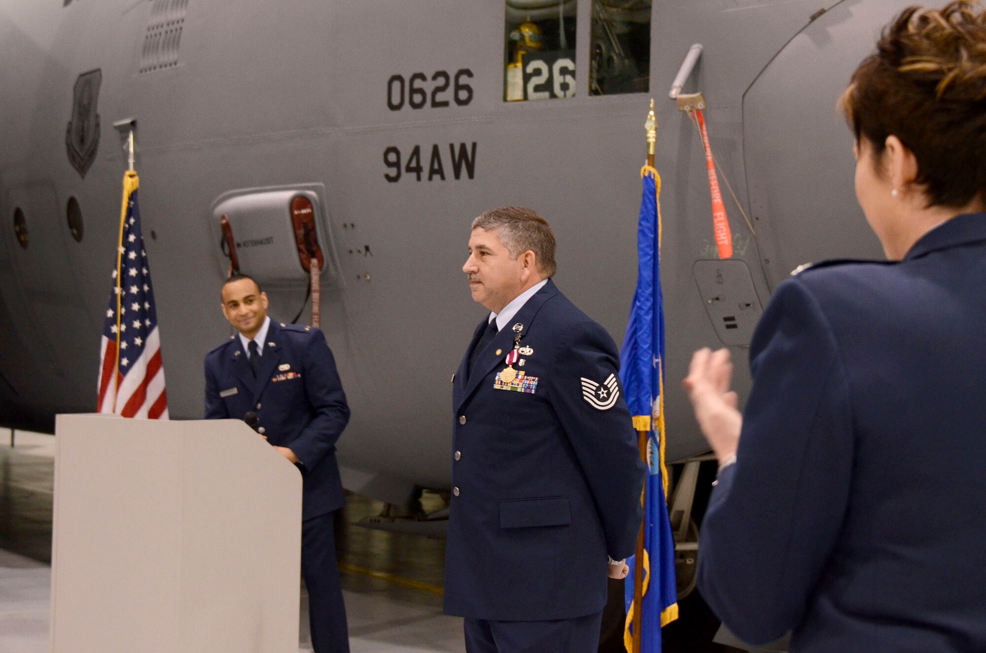 Tech. Sgt. William Combs, Jr., 94th Maintenance Squadron non-destructive inspection technician, is honored for 30 years of military service by Lt. Col. Kerri Ebrecht, 94th Maintenance Squadron commander, and 2nd Lt. Sean DeSouza during his retirement ceremony Feb. 1. (U.S. Air Force photo/Don Peek)