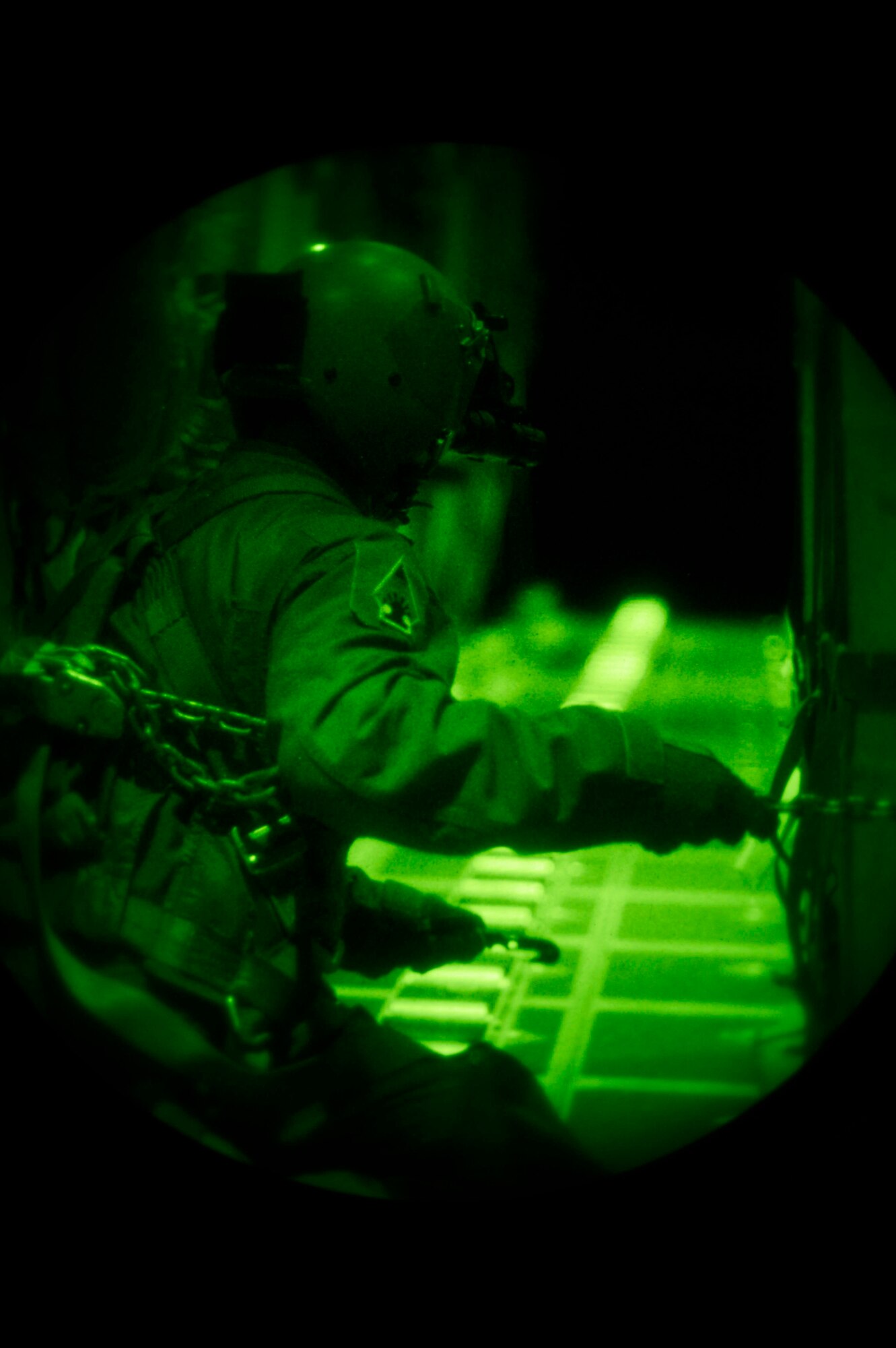 Staff Sgt. Bill Sauerer, 109th Airlift Squadron, cuts the strap to a containerized delivery system load in Yuma, Ariz., Feb. 26, 2014.  The CDS load simulates mission essential equipment such as vehicles, ammunition or rations being released from the C-130 Hercules.
(U.S. Air National Guard photo by Tech. Sgt. Amy M. Lovgren/Released)
