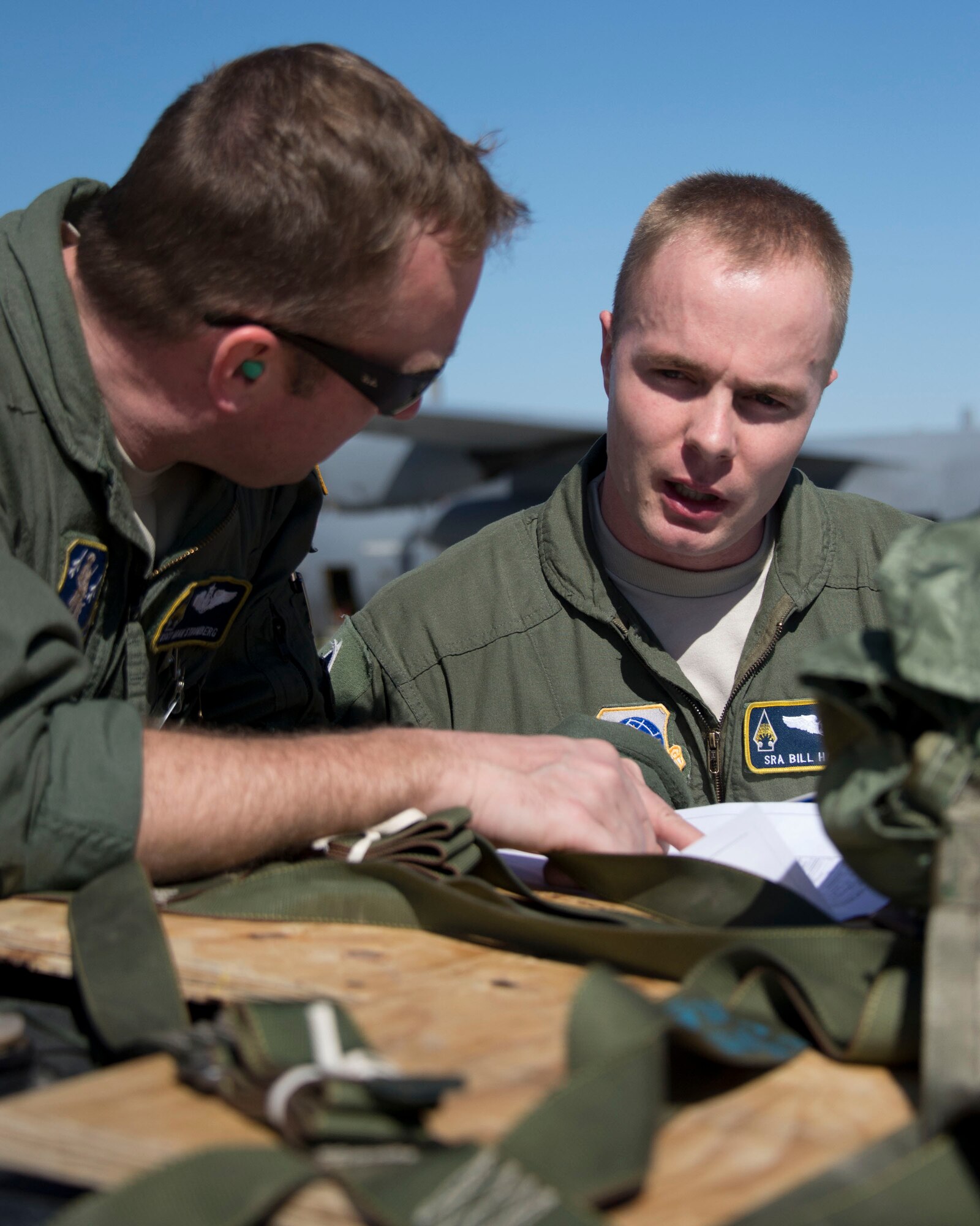 Master Sgt. Aran Stromberg, left, inspects the load plan with Senior Airman Bill Hanson, both from the 109th Airlift Squadron, in Yuma, Ariz., Feb. 26, 2014. The flight was a check-ride mission for Hanson, during which he was evaluated on his skills as a loadmaster.
(U.S. Air National photo by Tech. Sgt. Amy M. Lovgren/ Released)

