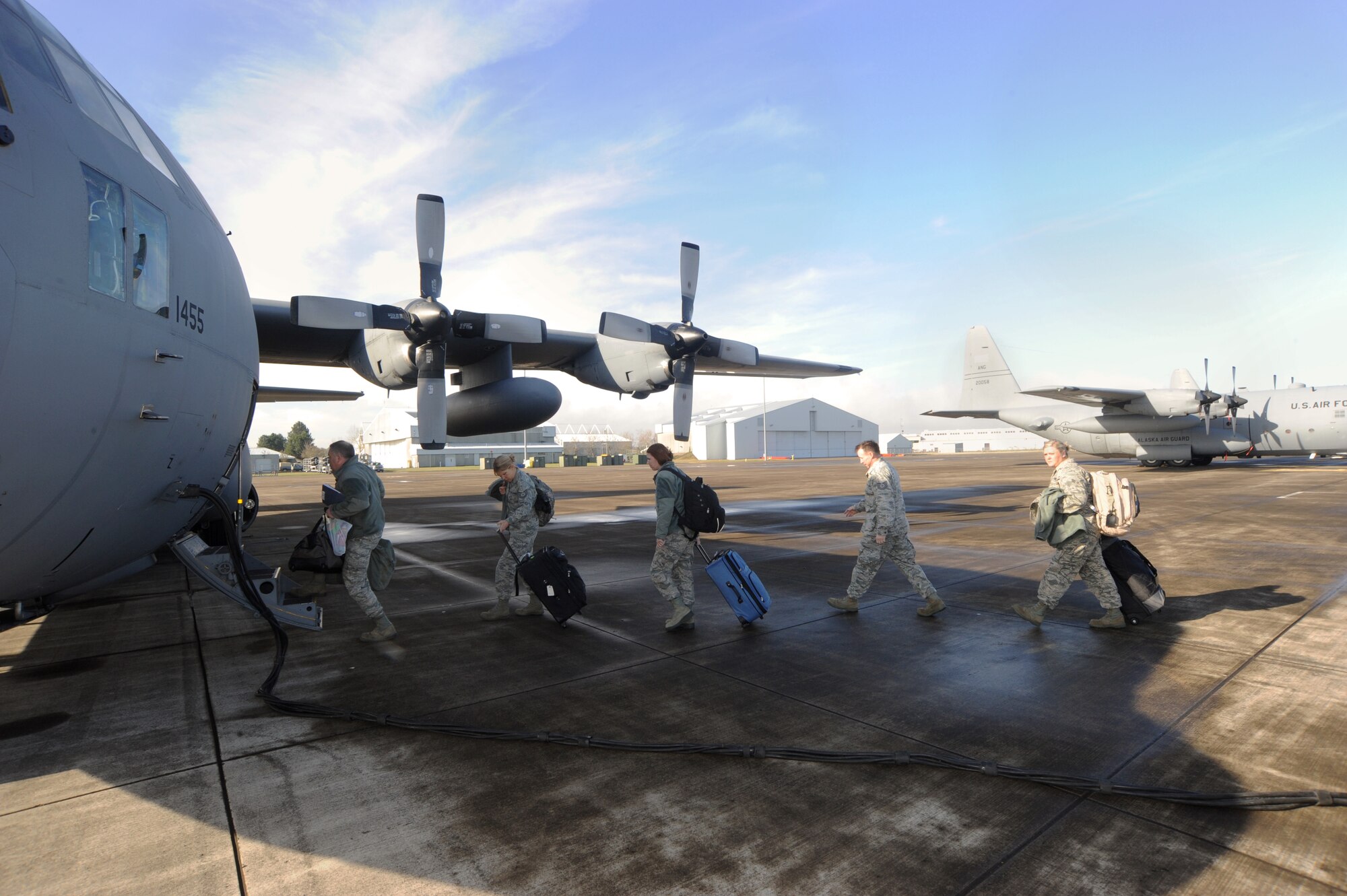 Members of the 142nd Fighter Wing board a C-130 Hercules at the Portland Air National Guard Base, Ore., prior to departing for Nellis Air Force Base, Nev., Feb. 28, 2014. (U.S. Air National Guard photo by Tech. Sgt. John Hughel/Released)