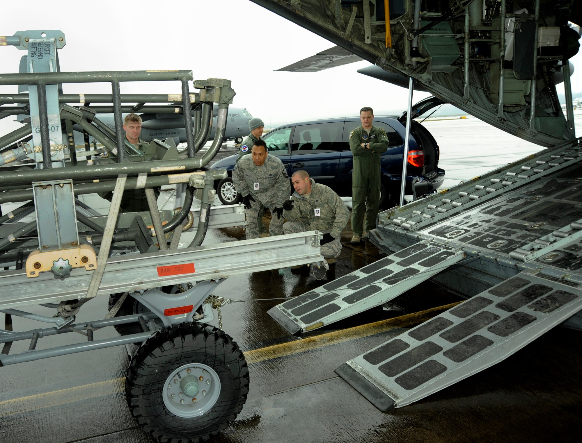 Oregon Air National Guard Logistical Readiness Squadron Inspectors from the 142nd Fighter Wing, insure that equipment is accurately packed into a C-130 Hercules, Portland Air National Guard Base, Ore., Feb. 27, 2014. (U.S. Air National Guard photo by Tech. Sgt. John Hughel/Released)