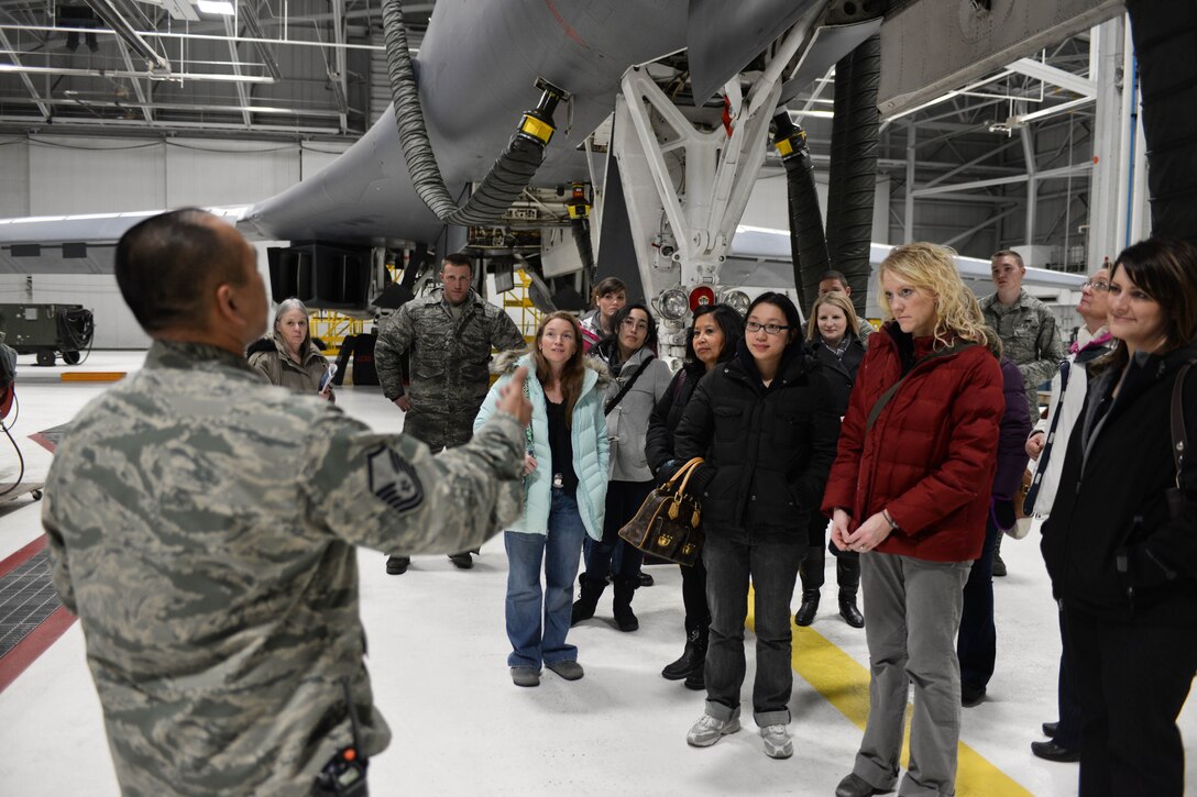 Master Sgt. Jason Justice, 28th Aircraft Maintenance Squadron production superintendent, provides information about the B-1 to Ellsworth spouses during the Heartlink orientation at Ellsworth Air Force Base, S.D., Feb. 28, 2013. Throughout the day, Col. Kevin Kennedy, 28th Bomb Wing commander, Chief Master Sgt. Kevin Peterson, 28th BW command chief, and several group commanders presented information about their respective organizations and the role they play in helping the base accomplish its mission. (U.S. Air Force photo by Senior Airman Zachary Hada/Released)