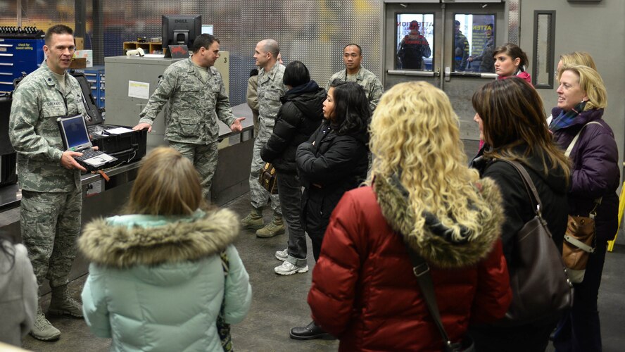 Lt. Col. Michael Colvard, 28th Aircraft Maintenance Squadron commander, provides a mission brief to Ellsworth spouses during the Heartlink orientation event at Ellsworth Air Force Base, S.D., Feb. 28, 2014. The Heartlink program is designed to provide base newcomers with an opportunity to get to know one another and learn from others in similar situations. (U.S. Air Force photo by Senior Airman Zachary Hada/Released)