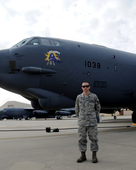 Staff Sgt. Michael Todaro, 2nd Aircraft Maintenance Squadron dedicated crew chief, poses for a photo in front of his aircraft on Barksdale Air Force Base, La., Mar 4, 2014. Todaro was recently selected as a crew chief position on Air Force 2 at Andrew Air Force Base, Md. (U.S. Air Force photo/Staff Sgt. Sean Martin)