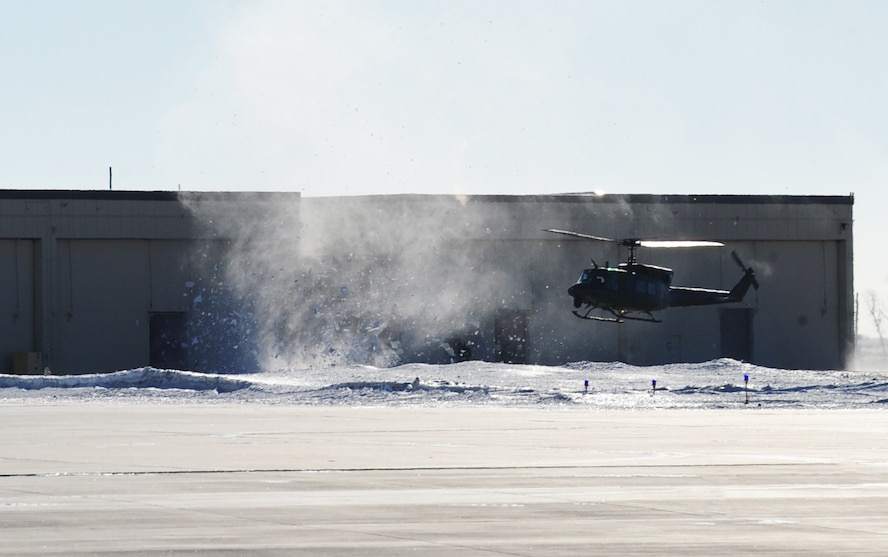 A UH-N1 helicopter lands near the tactical response force building preparing to pick personnel up at Minot Air Force Base, N.D., Feb. 21, 2014. TRF relies on the 54th Helicopter Squadron to taxi Airmen to destinations quickly and efficiently. (U.S. Air Force photo/Senior Airman Andrew Crawford)