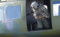 Tech. Sgt. Tim McKinley, 54th Helicopter Squadron flight engineer, checks the side of the UH-N1 helicopter just before takeoff from Minot Air Force Base, N.D., Feb. 21, 2014. Part of the takeoff procedure is for the flight engineer to check the area surrounding the helicopter to ensure there are no individuals near it. (U.S. Air Force photo/Senior Airman Andrew Crawford)