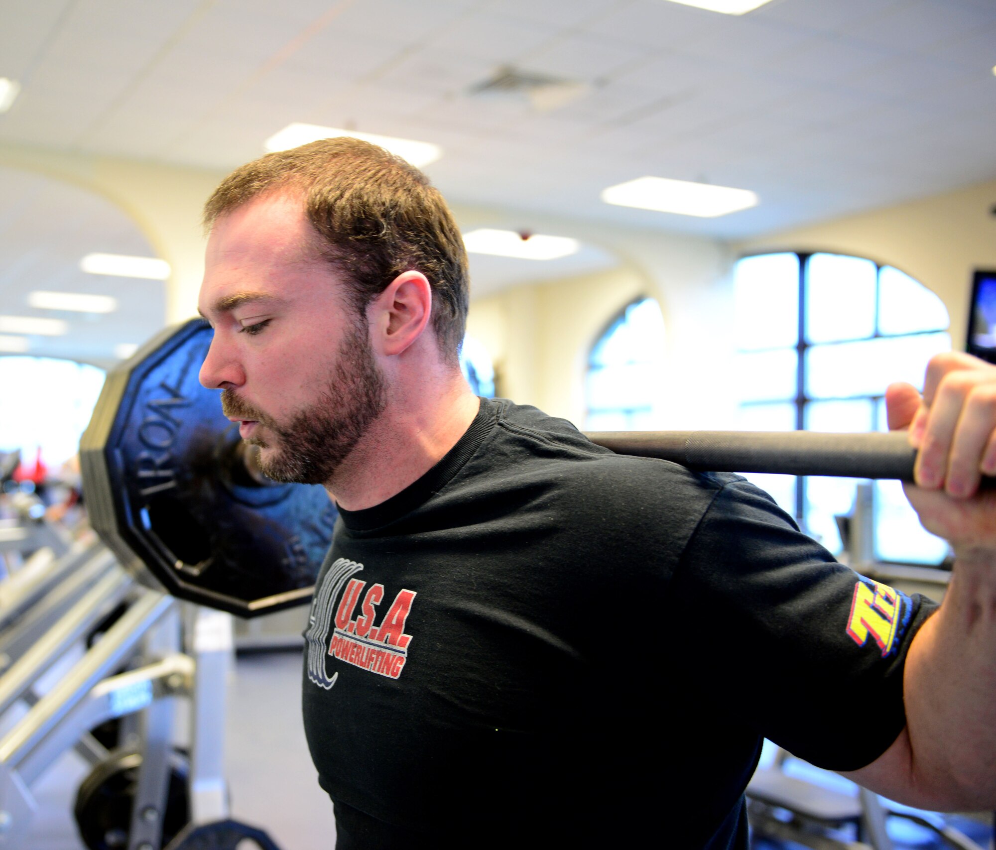 Mike Tuchscherer, a competitive powerlifter, lifts weights at the Dragon Fitness Center, March 6, 2014, at Aviano Air Base, Italy. Tuchscherer, a competitive lifter, broke the International Powerlifting world record in deadlift with 819 pounds during the Arnold Sports Festival in Columbus, Ohio. (U.S. Air Force photo/Senior Airman Matthew Lotz)