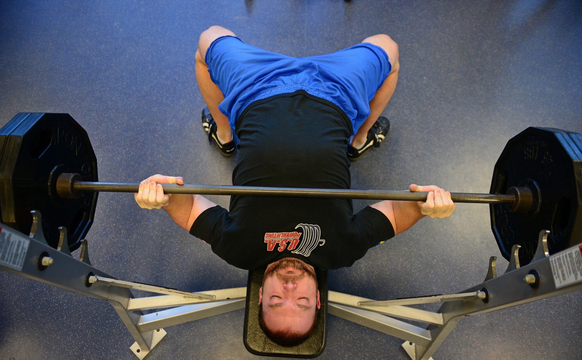 Mike Tuchscherer , a competitive powerlifter, lifts weights at the Dragon Fitness Center, March 6, 2014, at Aviano Air Base, Italy. Tuchscherer broke the International Powerlifting world record in deadlift with 819 pounds during the Arnold Sports Festival in Columbus, Ohio. The festival hosts 175,000 attendees competing in approximately 50 different sports per year, including powerlifting. (U.S. Air Force photo/Senior Airman Matthew Lotz)