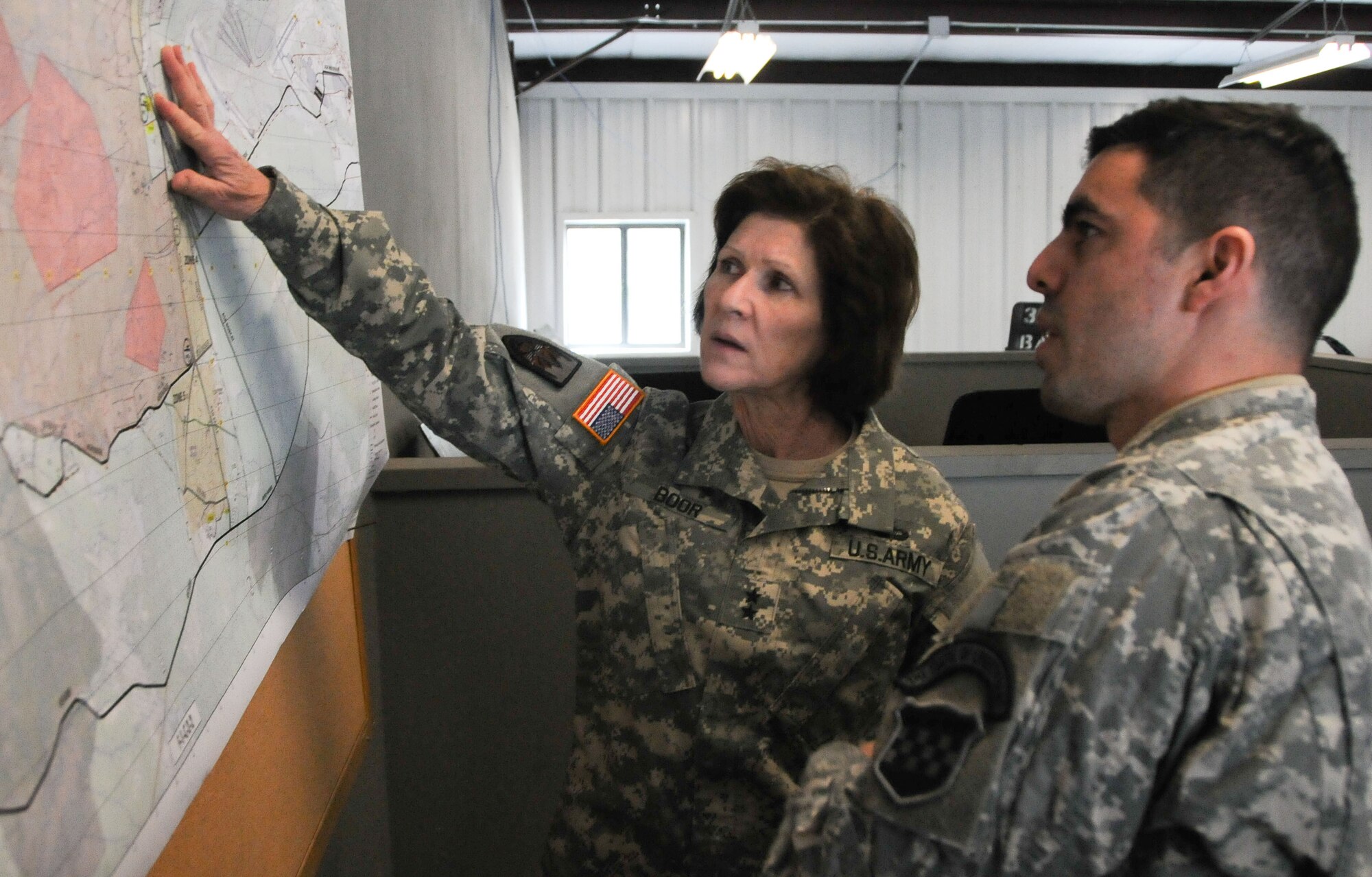 Gen. Margaret W. Boor, commanding general of the Army Reserve’s 99th Regional Support Command, discusses upcoming training Feb. 25 with Chief Warrant Officer 2 Luis Santiago, commander of the 99th RSC’s 319th Army Band, during the Army Reserve’s joint Combat Support Training Exercise at Joint Base McGuire-Dix-Lakehurst, N.J. (U.S. Army photo by Staff Sgt. Shawn Morris/Released)