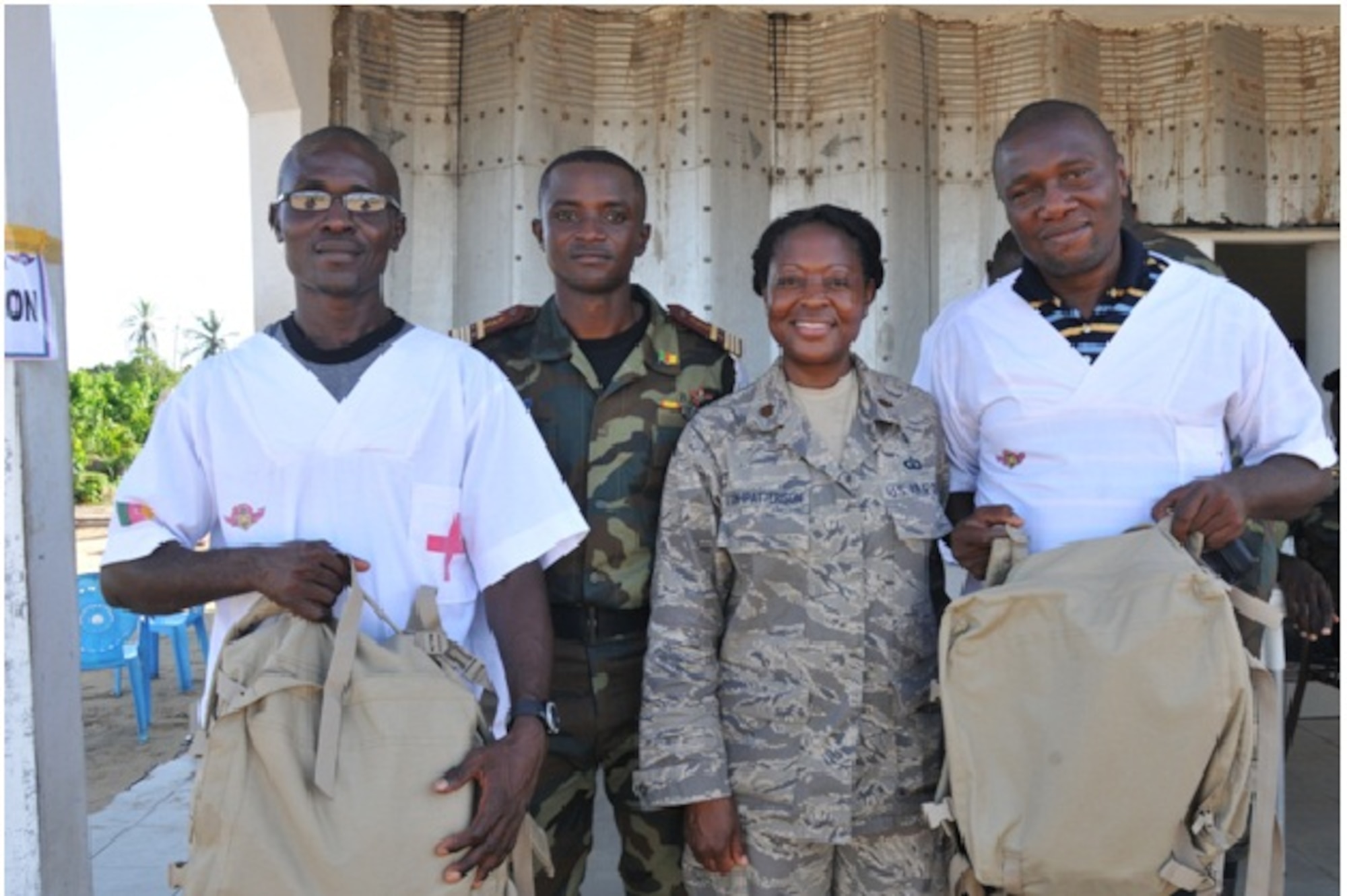 Maj Angelique Vann-Patterson, U.S. Air Forces in Europe - Air Forces Africa international health specialist, with Cameroonian army officer and civilian Health Care Workers during humanitarian civic assistance activities in Manouka, Cameroon. (Courtesy photo)