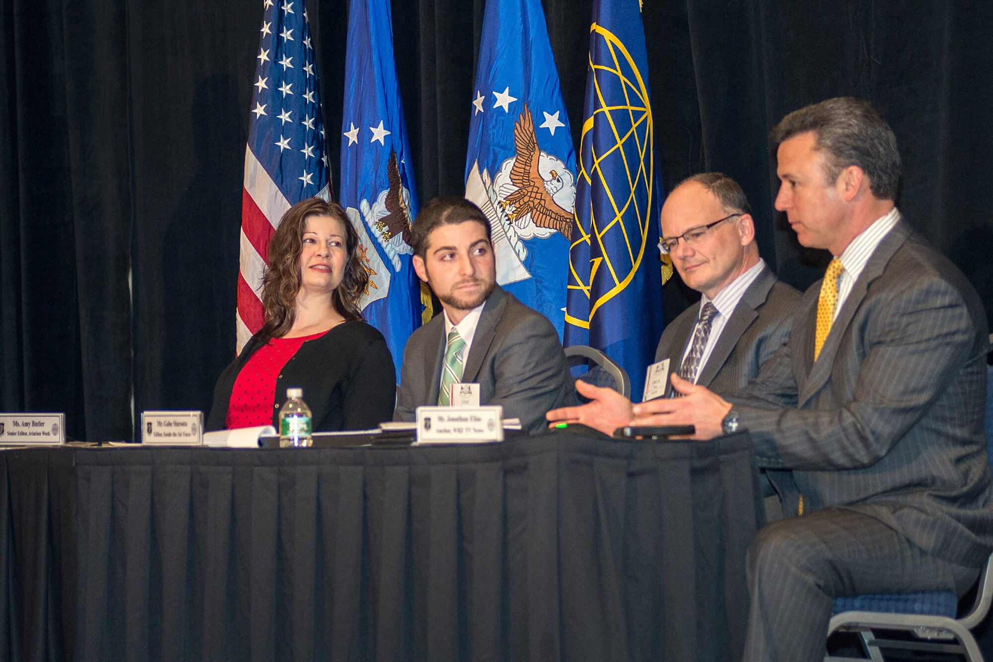 NEWTON, Mass. - Jonathan Elias (right), WBZ-TV news anchor, discusses news
reporting with (from left to right): Amy Butler, Aviation Week senior
Pentagon editor, Gabe Starosta, Inside the Air Force managing editor, and
Chuck Paone, Hanscom AFB Public Affairs director, during a media panel at
the New Horizons symposium Feb. 26. The panel highlighted the government,
media and industry relationship and provided insight into the similarities
and differences between the organizations.  (U.S. Air Force photo by Rick
Berry)
