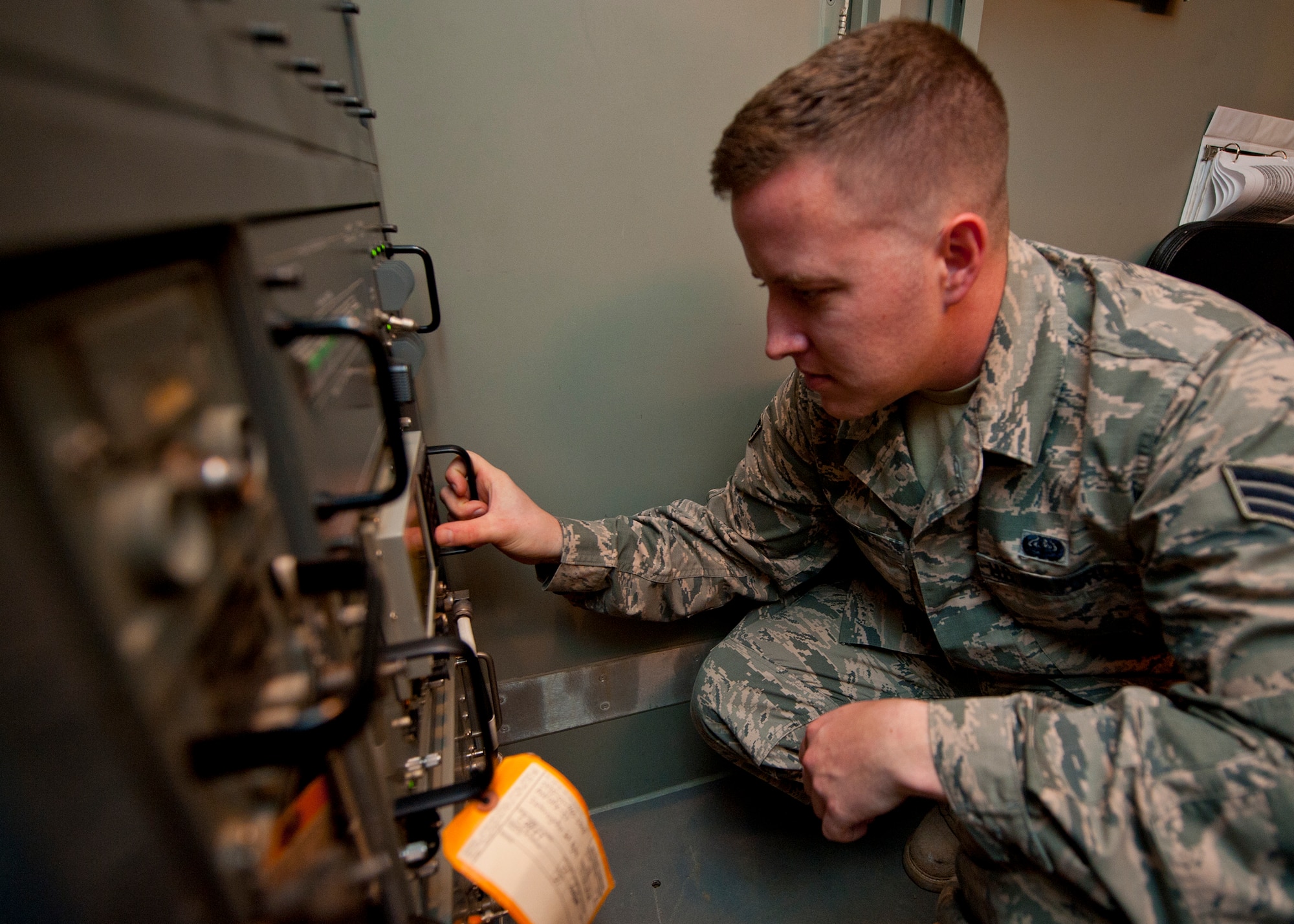 Senior Airman Justin Elder, a ground radar systems technician assigned to the 727th Expeditionary Air Control Squadron, performs preventative maintenance on a UPX-37 secondary radar at an undisclosed location in Southwest Asia, March 5, 2014. Elder is a native of Atlanta, Ga., and is deployed here from Hunter Army Airfield in Savannah, Ga. (U.S. Air Force photo by Staff Sgt. Michael Means/Released)