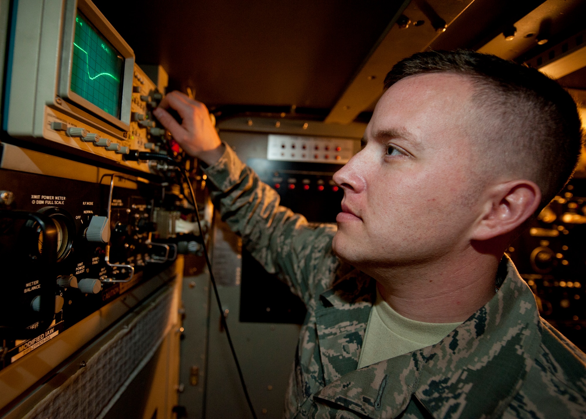 Senior Airman Justin Elder, a ground radar systems technician assigned to the 727th Expeditionary Air Control Squadron, checks a mod inverse pulse using an oscilloscope at an undisclosed location in Southwest Asia, March 5, 2014. Elder is a native of Atlanta, Ga., and is deployed here from Hunter Army Airfield in Savannah, Ga. (U.S. Air Force photo by Staff Sgt. Michael Means/Released)