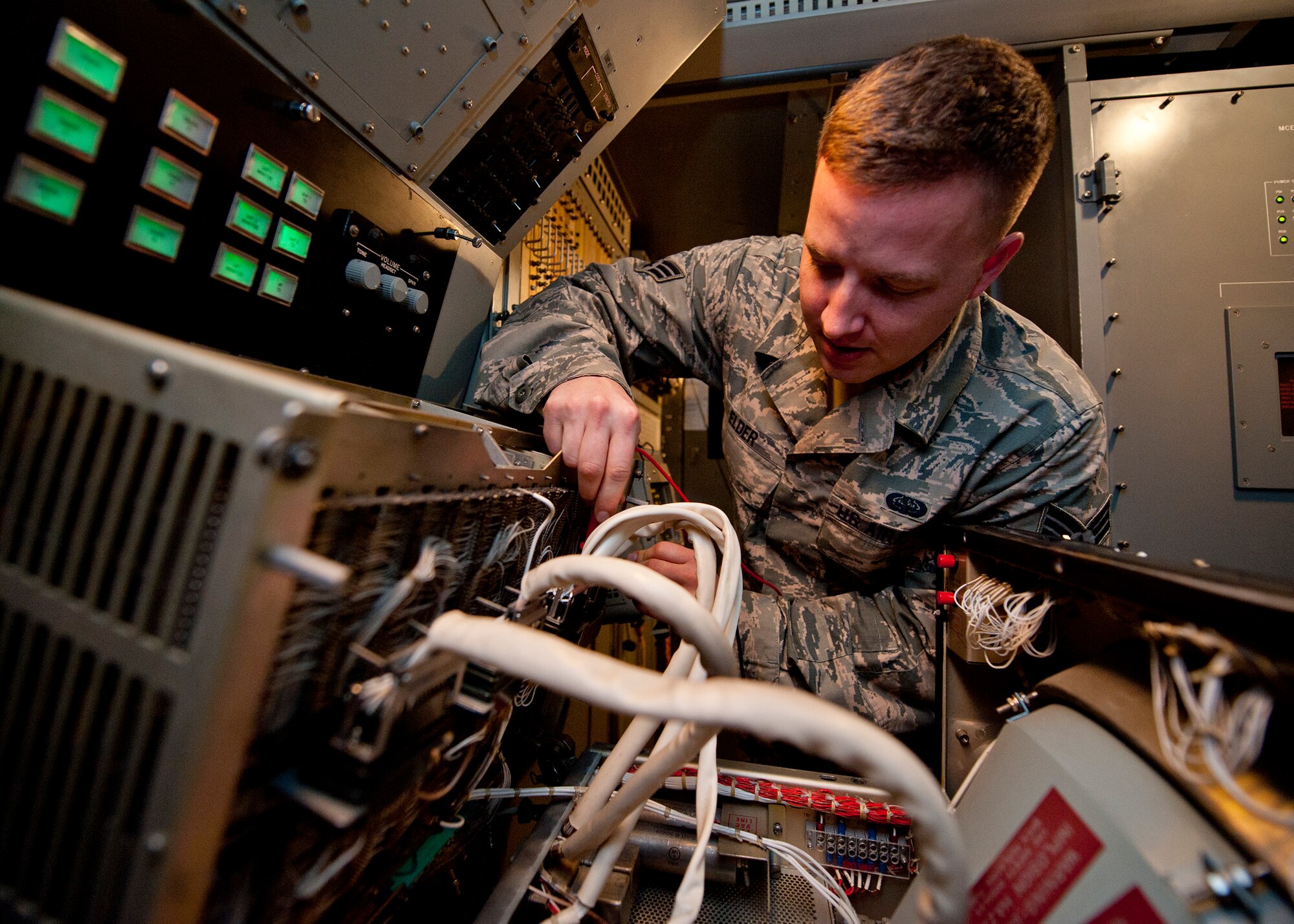 Senior Airman Justin Elder, a ground radar systems technician assigned to the 727th Expeditionary Air Control Squadron, uses a multimeter to measure voltage, current, and resistance while performing preventative maintenance on a YUK-27 at an undisclosed location in Southwest Asia, March 5, 2014. Elder is a native of Atlanta, Ga., and is deployed here from Hunter Army Airfield in Savannah, Ga. (U.S. Air Force photo by Staff Sgt. Michael Means/Released)