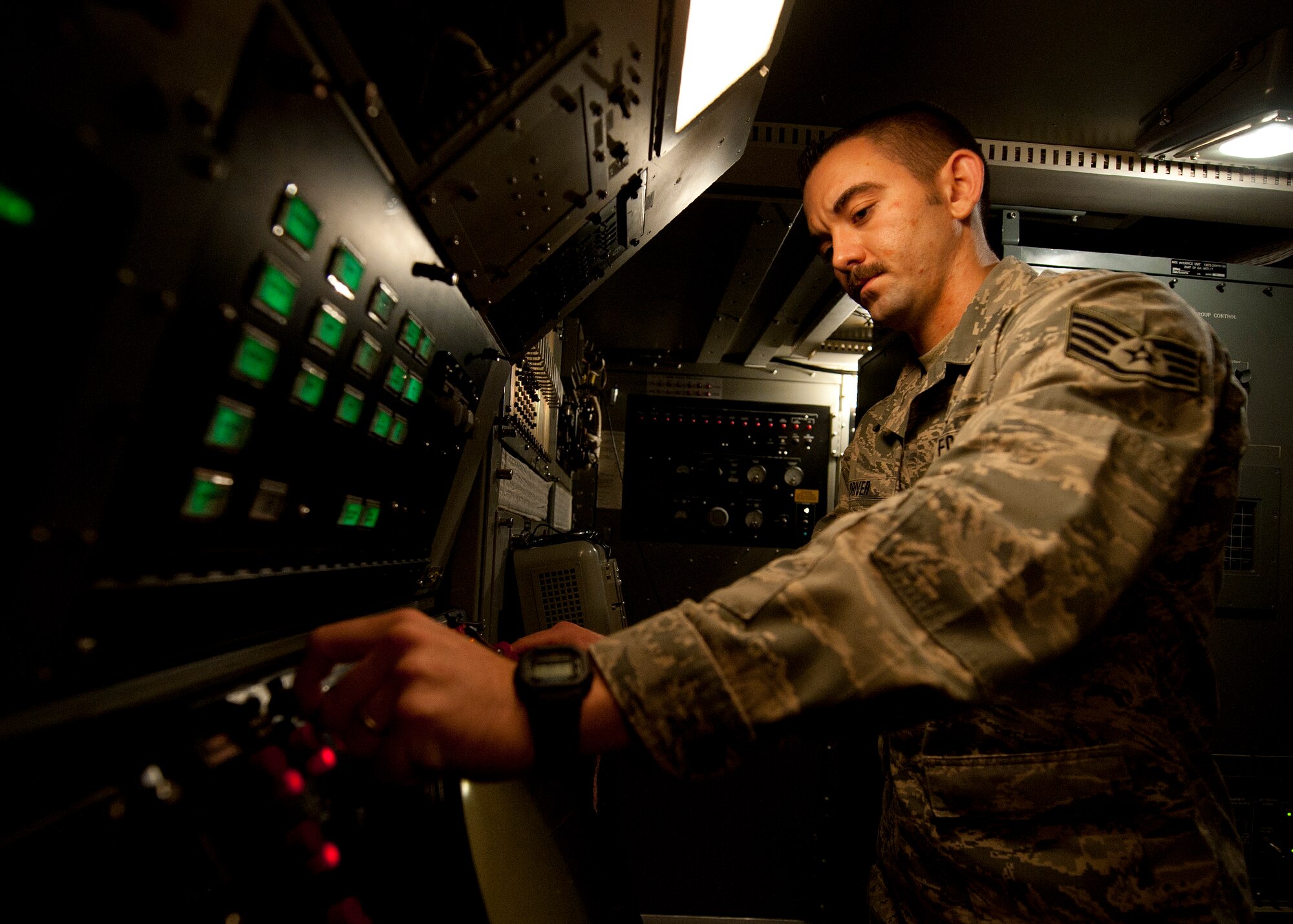 Staff Sgt. Aaron Driver, a ground radar systems technician assigned to the 727th Expeditionary Air Control Squadron, performs preventative maintenance on a YUK-27 at an undisclosed location in Southwest Asia, March 5, 2014. Driver is a native of Savannah, Ga., and is deployed here from Hunter Army Airfield. (U.S. Air Force photo by Staff Sgt. Michael Means/Released)