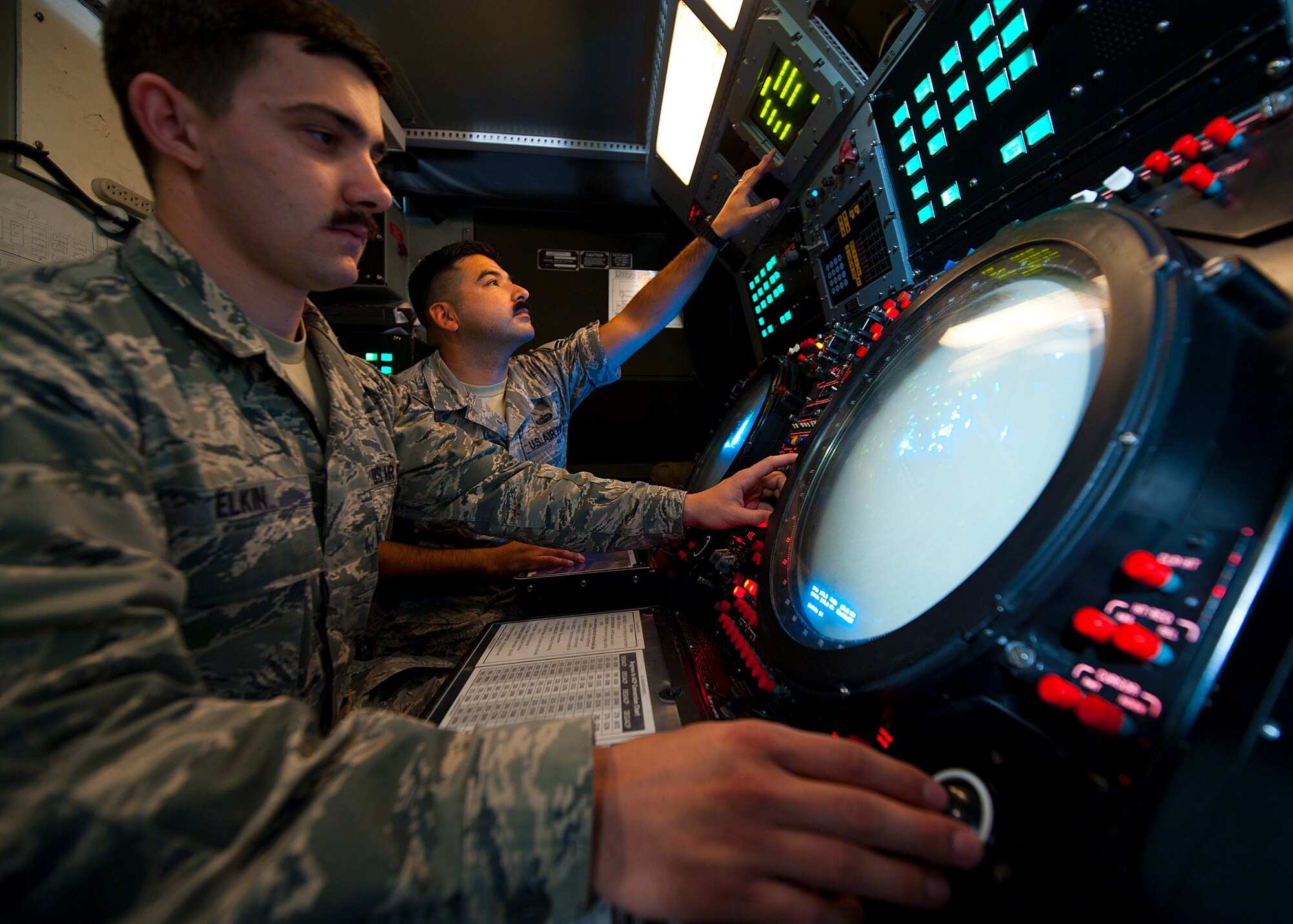 Master Sgt. Gilberto Lucero and Senior Airman Blake Elkin, ground radar systems technicians assigned to the 727th Expeditionary Air Control Squadron, check aircraft targets to make sure the radar system is properly calibrated after a preventative maintenance inspection at an undisclosed location in Southwest Asia, March 3, 2014. Lucero is a native of Azusa, Calif., and Elkin is a native of Phoeniz, Ariz. Both airmen are deployed here from Hunter Army Airfield in Savannah, Ga. (U.S. Air Force photo by Staff Sgt. Michael Means/Released)