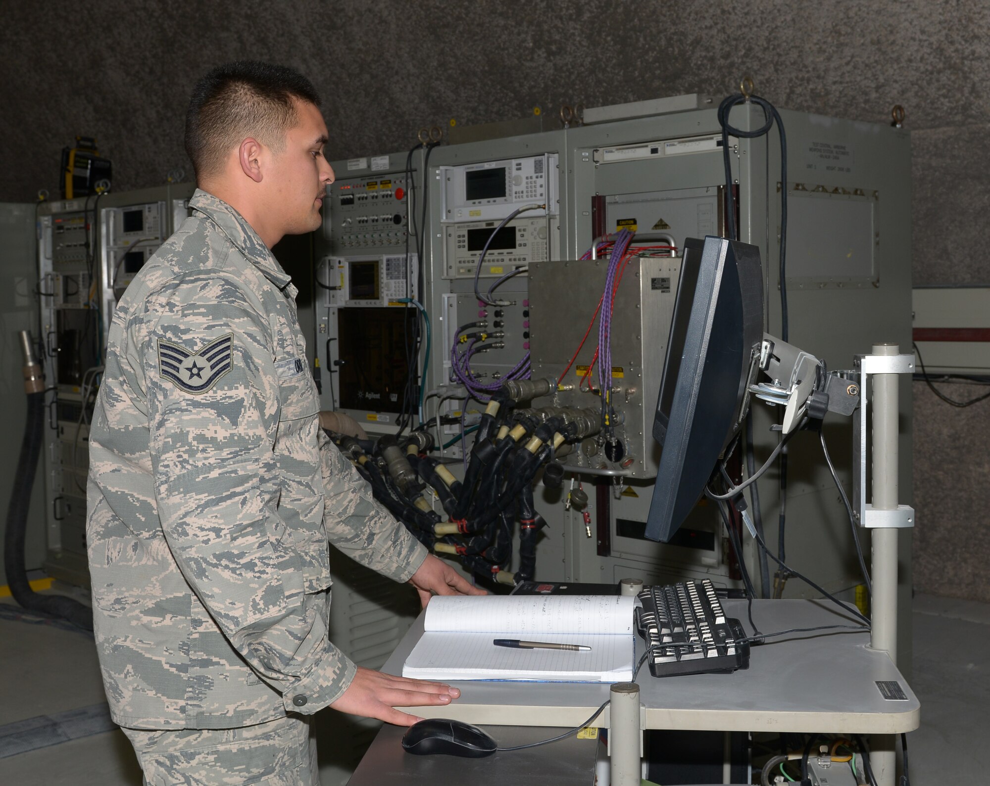 Staff Sgt. Allen Orr runs a confidence and diagnostic test on an interface test adapter at Al Udeid Air Base, Qatar, Mar. 4, 2014. The interface test adapter is used by avionics Airmen to troubleshoot line replaceable units that need repairs. The 379th Expeditionary Maintenance Squadron avionics flight houses the only avionics repair facility throughout the U.S. Air Forces Central Command area of responsibility. Orr, 379th EMXS F-15 avionics team leader, is deployed from Seymour Johnson Air Force Base, N.C., and a Sault Ste. Marie, Mich., native. (U.S. Air Force photo/Senior Airman Hannah Landeros)