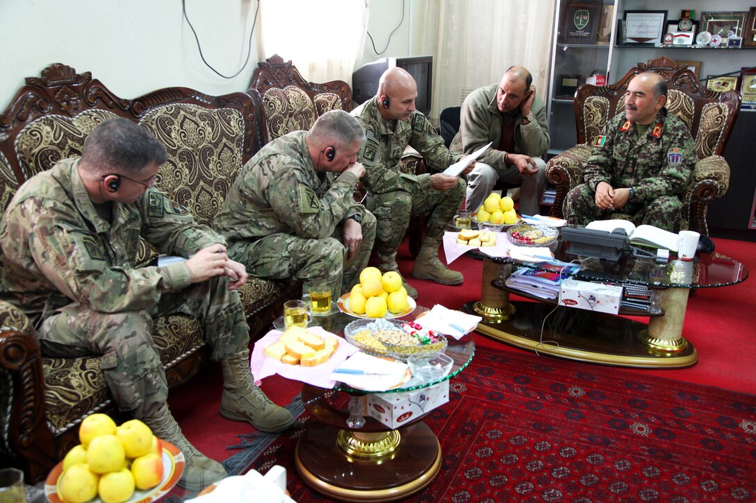 U.S. Army Brig. Gen. David Haight, left, U.S. Army Lt. Gen. Joseph Anderson, second from left, and Afghan Army Maj. Gen. Mohammad Yaftali, right, discuss upcoming elections on Forward Operating Base Thunder in Afghanistan's Paktia province, March 5, 2014. Anderson is commander of the 18th Airborne Corps, Haight is assigned to the 10th Mountain Division and Yaftali is commanding general of the 203rd Corps.
