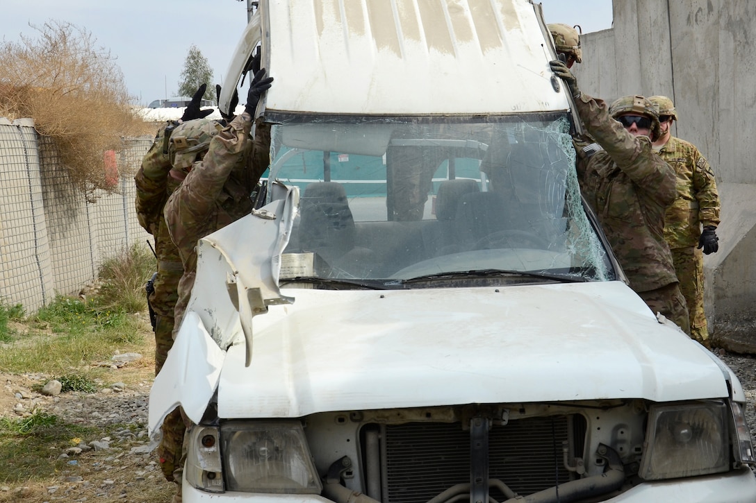 U.S. soldiers remove the roof of a Ford Ranger truck during vehicle extraction training on Forward Operating Base Fenty, Afghanistan, Feb. 25, 2014. 