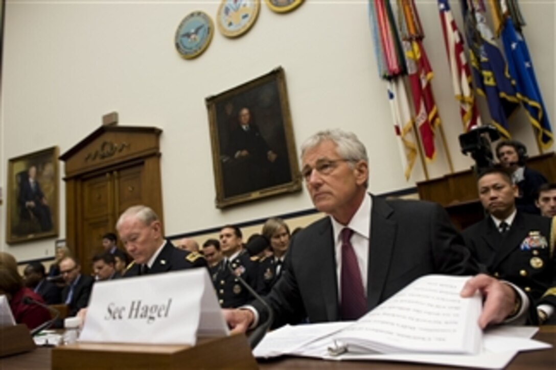 Defense Secretary Chuck Hagel, center, Army Gen. Martin E. Dempsey, chairman of the Joint Chiefs of Staff, and Robert F. Hale, the Defense Department's comptroller, testify on the fiscal year 2015 budget request before the House Armed Services Committee in Washington, D.C., March 6, 2014. 