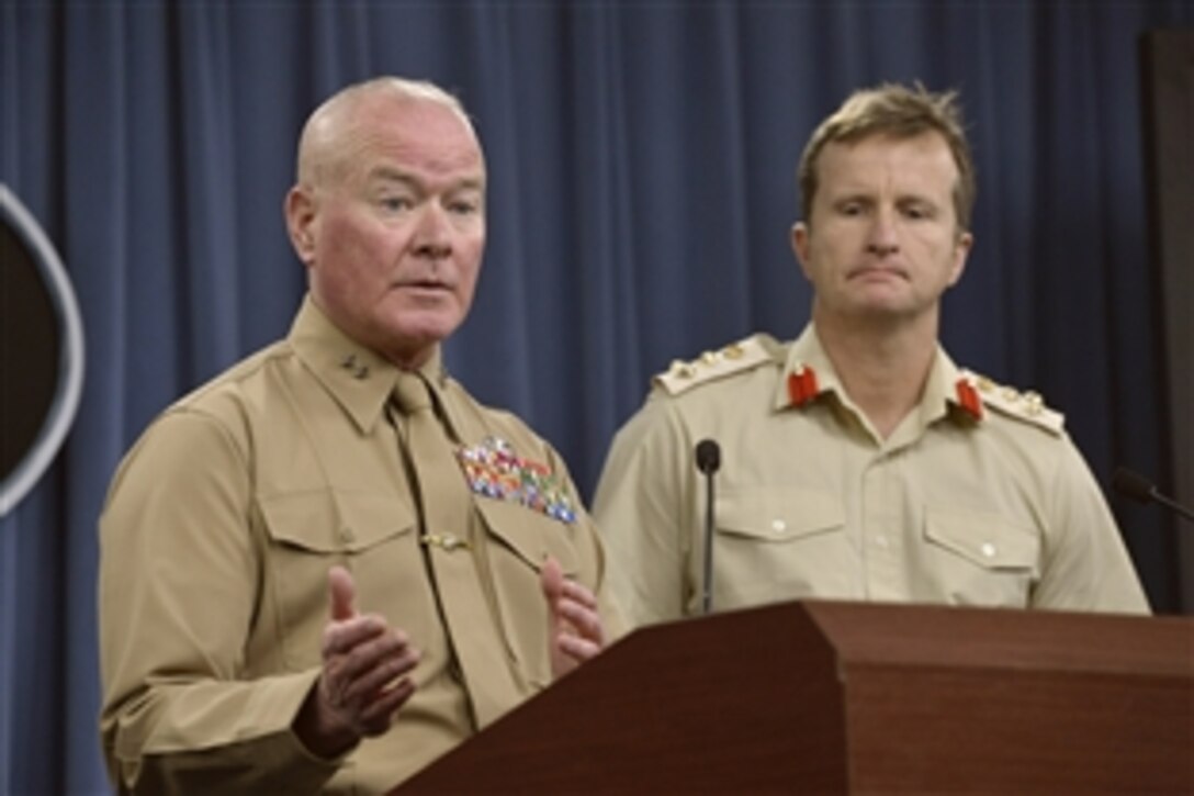 Marine Corps Maj. Gen. Walter Lee Miller Jr., former commanding general of Regional Command Southwest and 2nd Marine Expeditionary Force, and British Army Brigadier Paul A.E. Nanson, his former deputy commanding general, brief reporters on operations in Afghanistan at the Pentagon, March 6, 2014. 